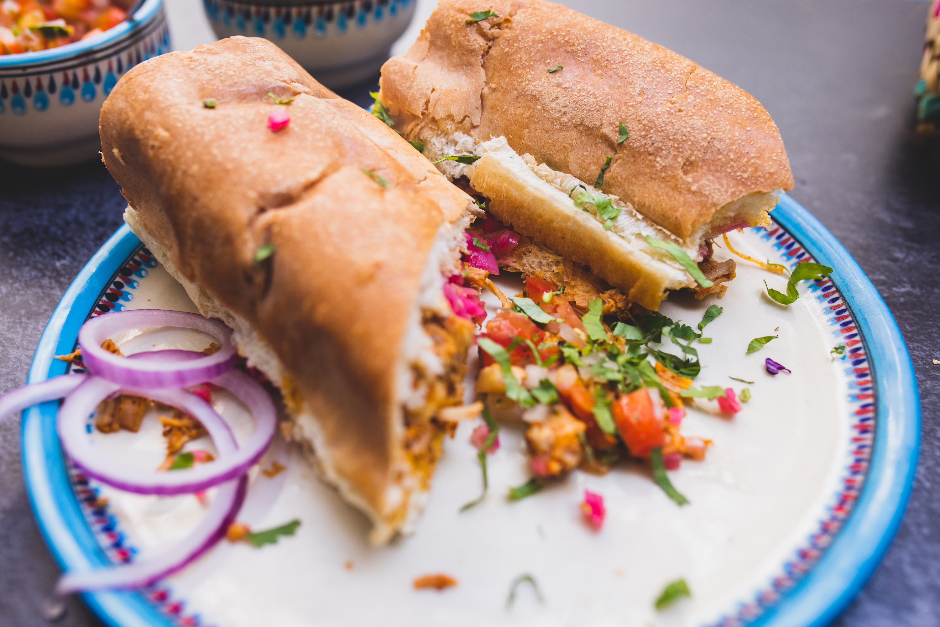 Spicy Sandwich with Fresh Toppings on Decorative Plate
