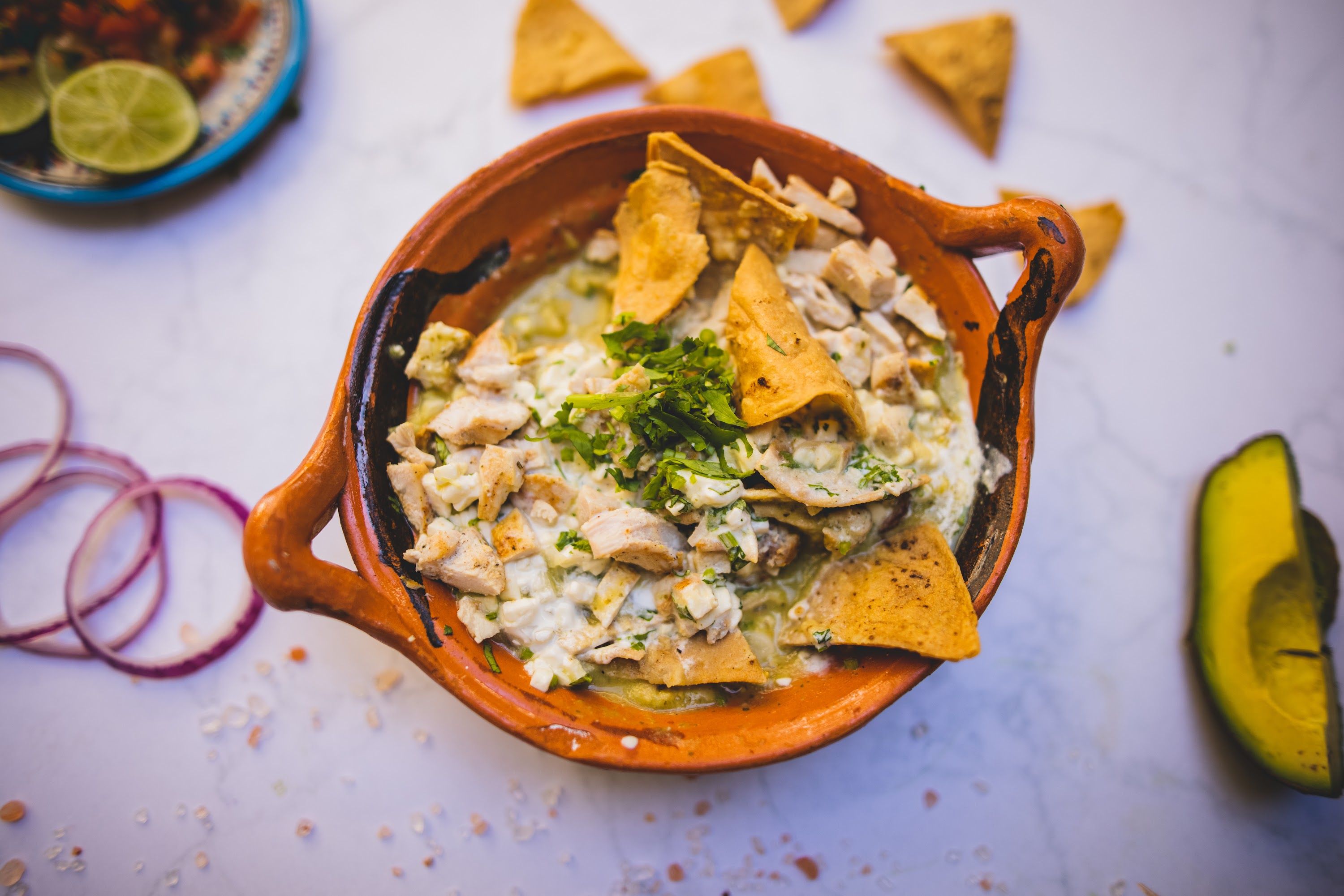 Mexican Chicken Pozole with Tortilla Chips and Fresh Garnishes