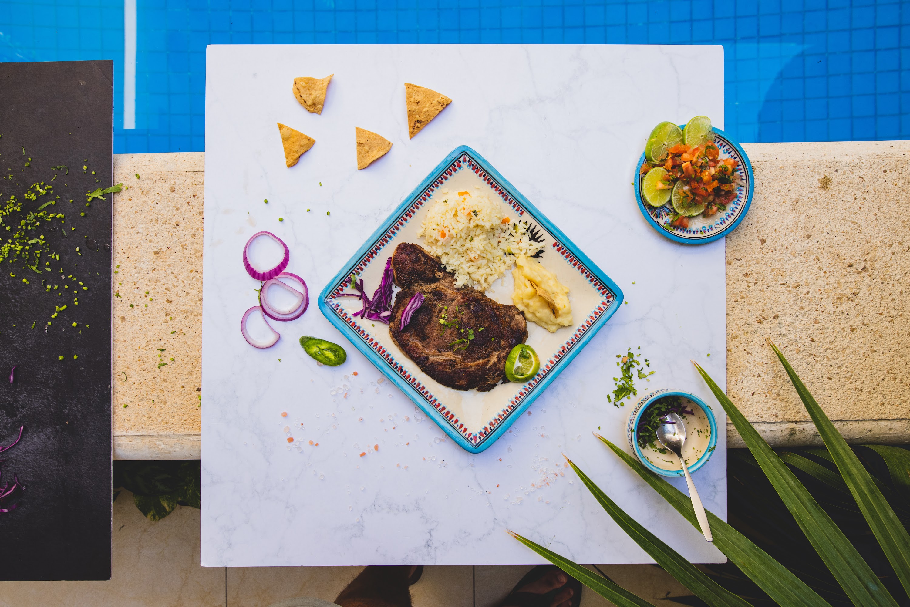 Grilled Steak with Rice and Salsa by the Poolside