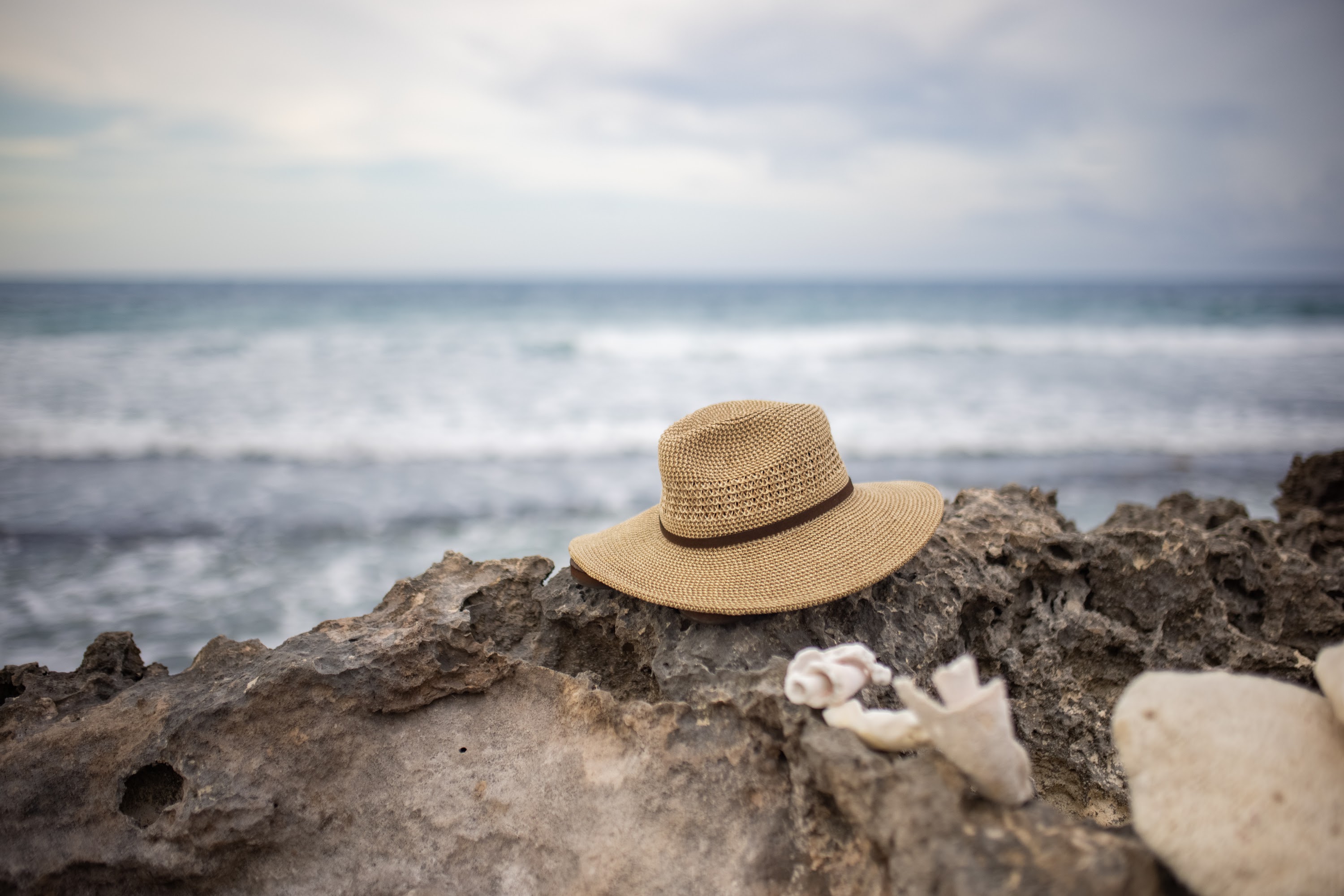 Straw Hat on Rocky Shoreline