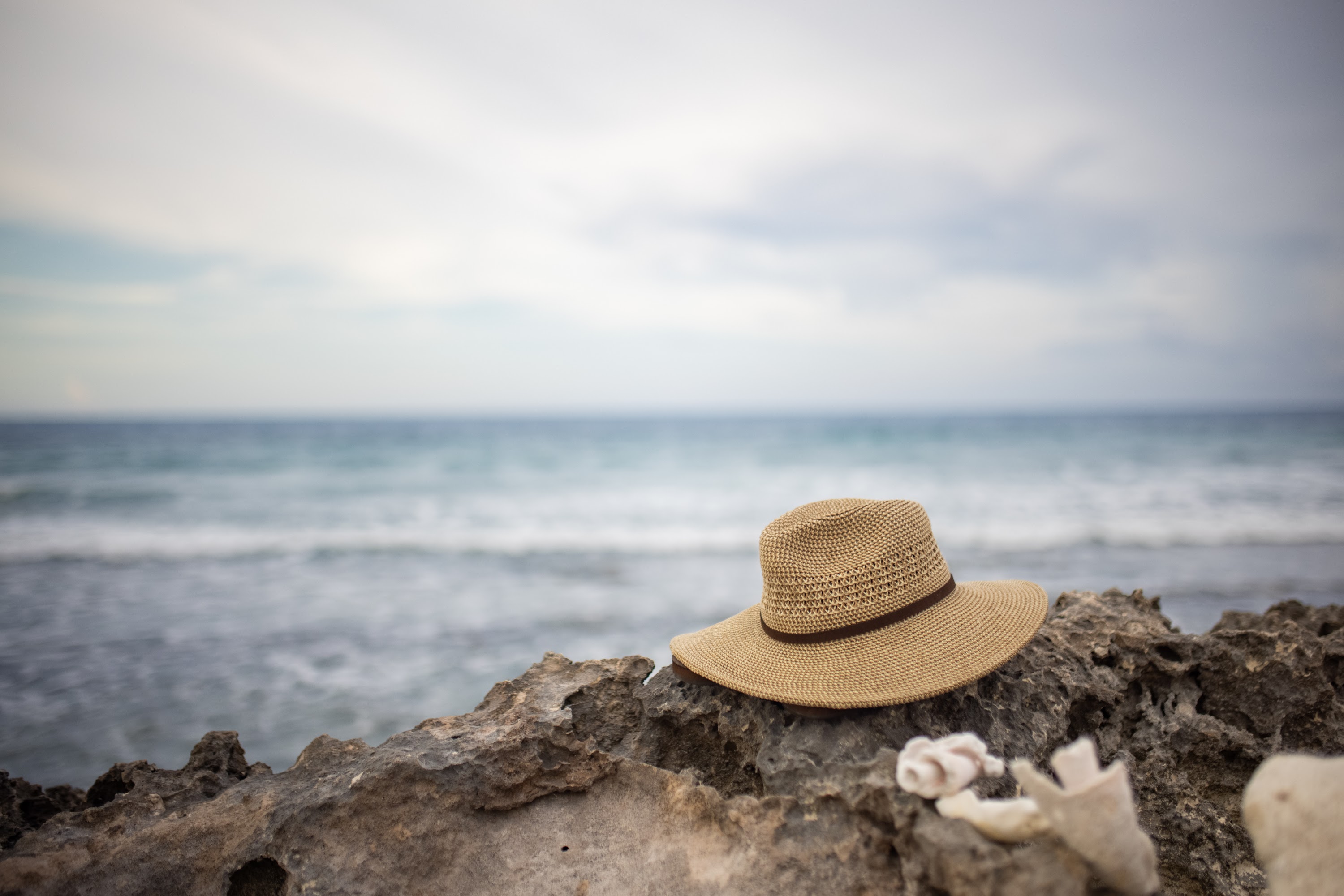 Straw Hat on Rocky Shoreline