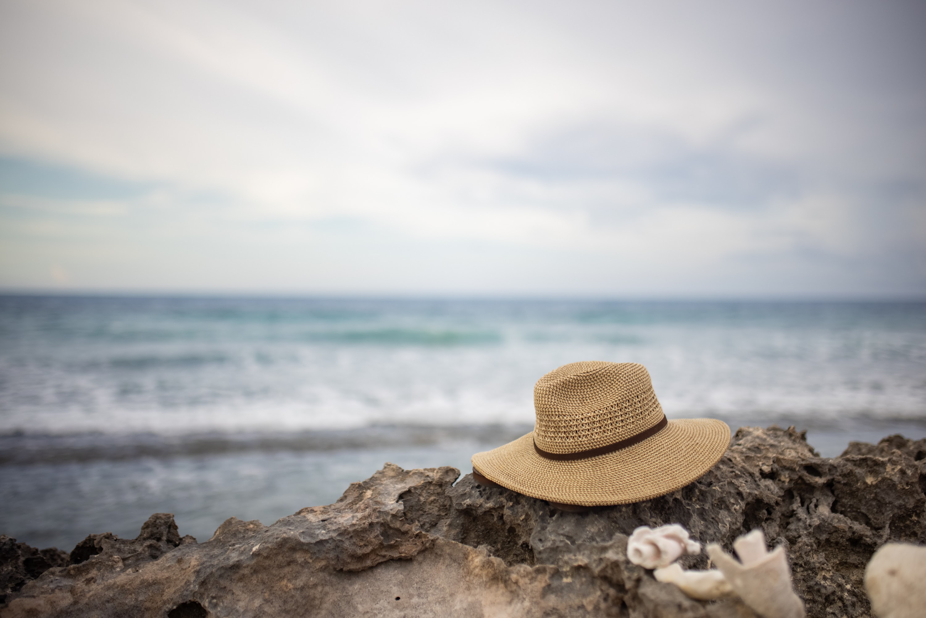 Straw Hat on Rocky Beach