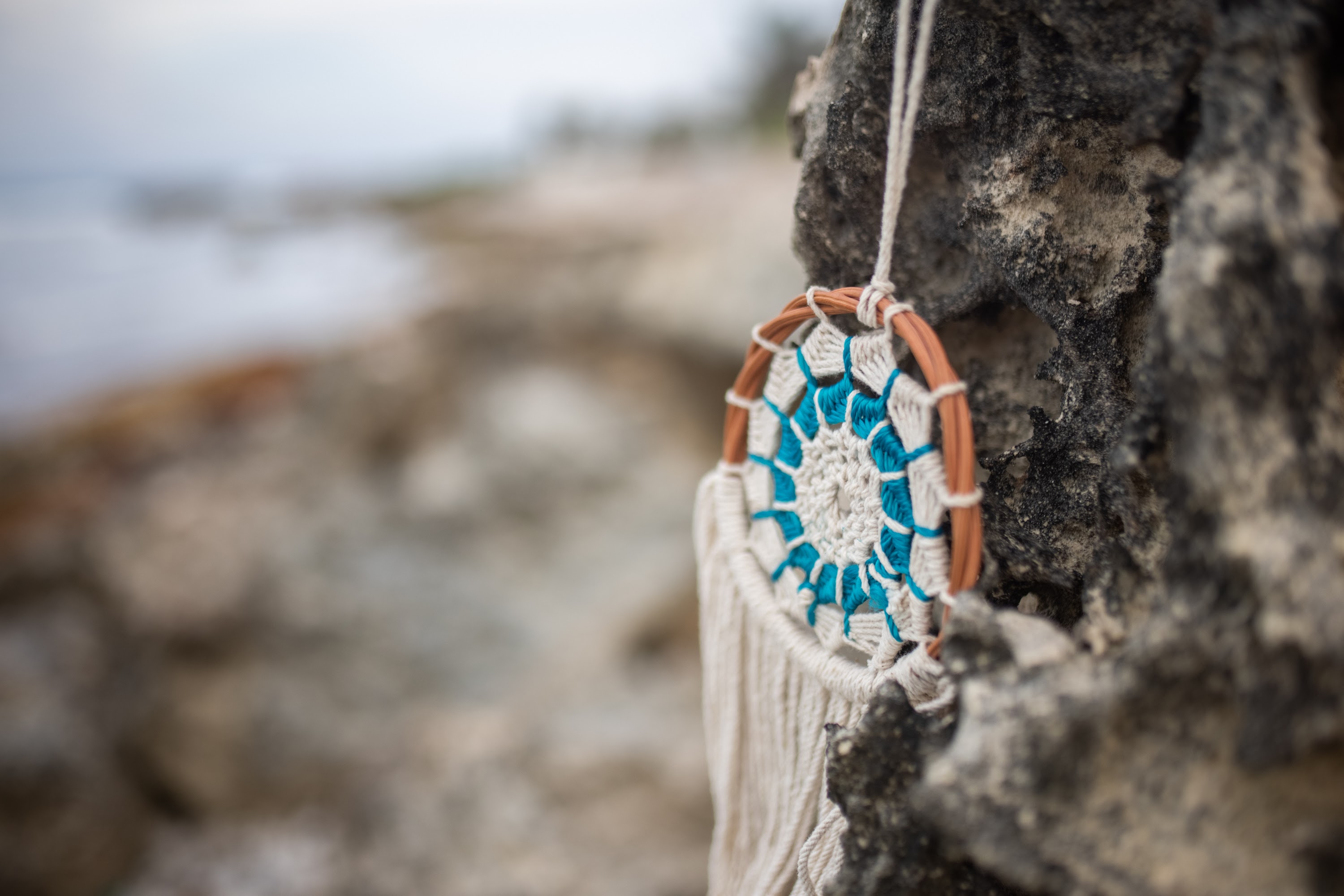 Dreamcatcher Hanging on Rock by the Sea