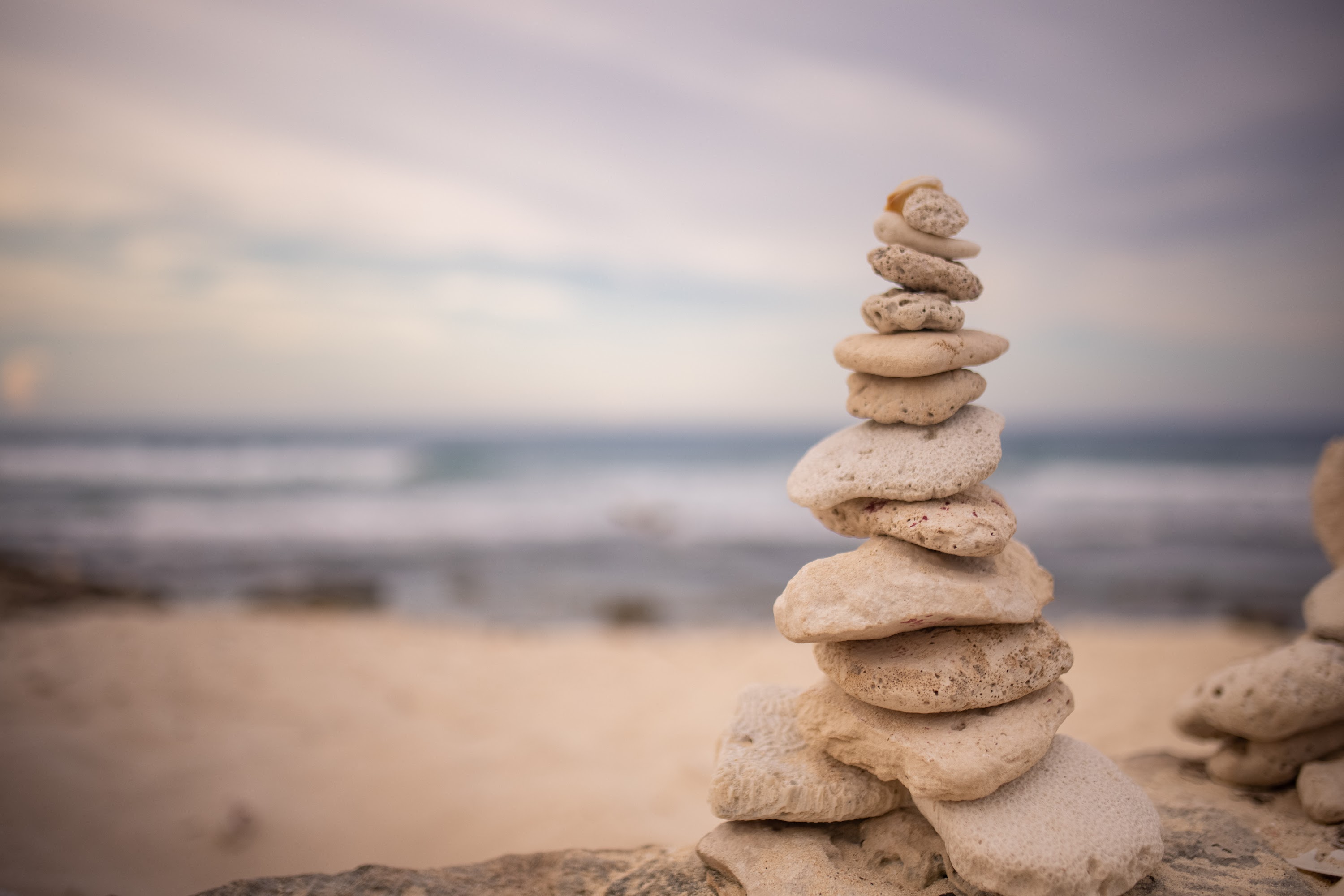 Stacked Stones on Beach at Dusk