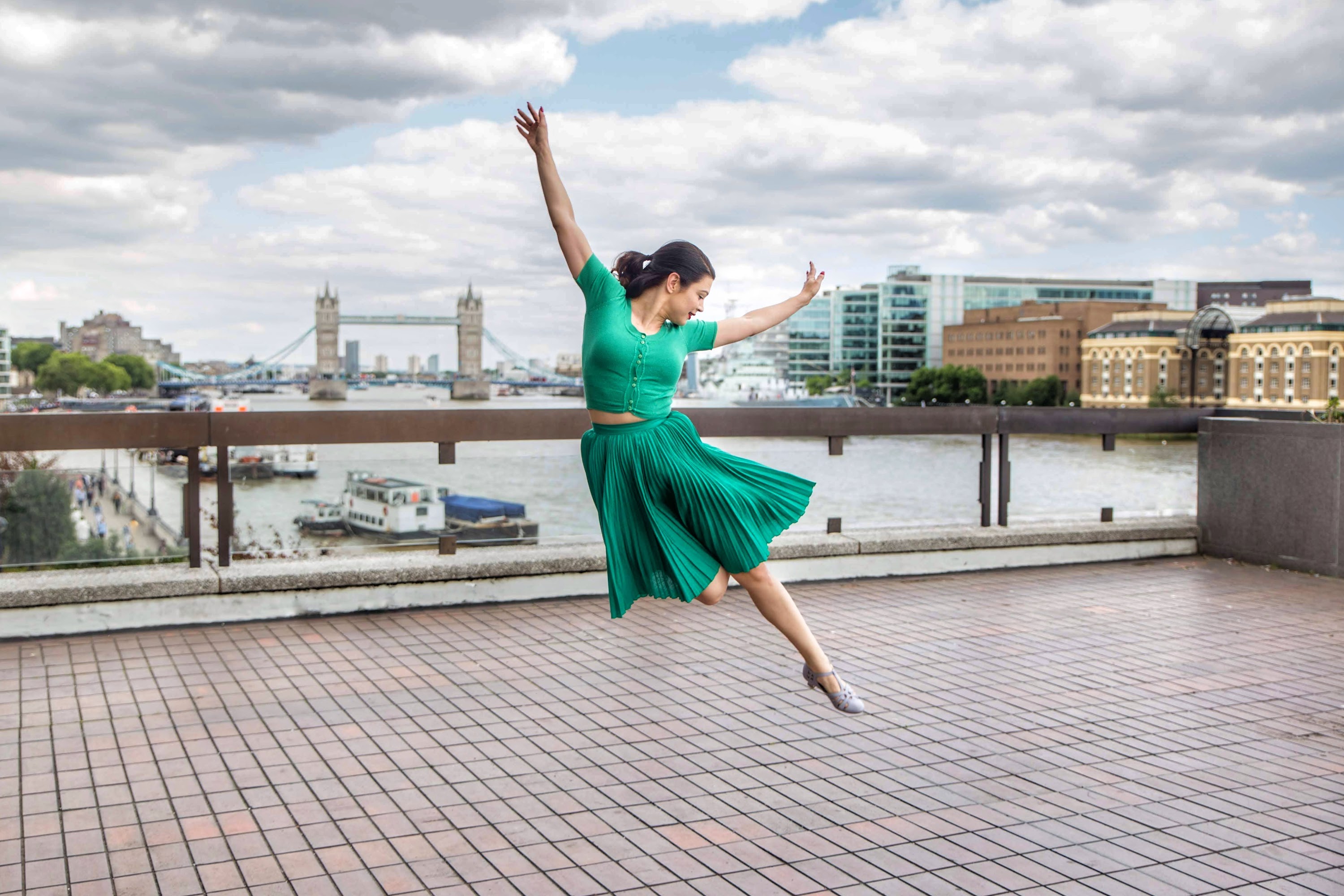 Ballerina in Green Dress Leaping on London Riverfront