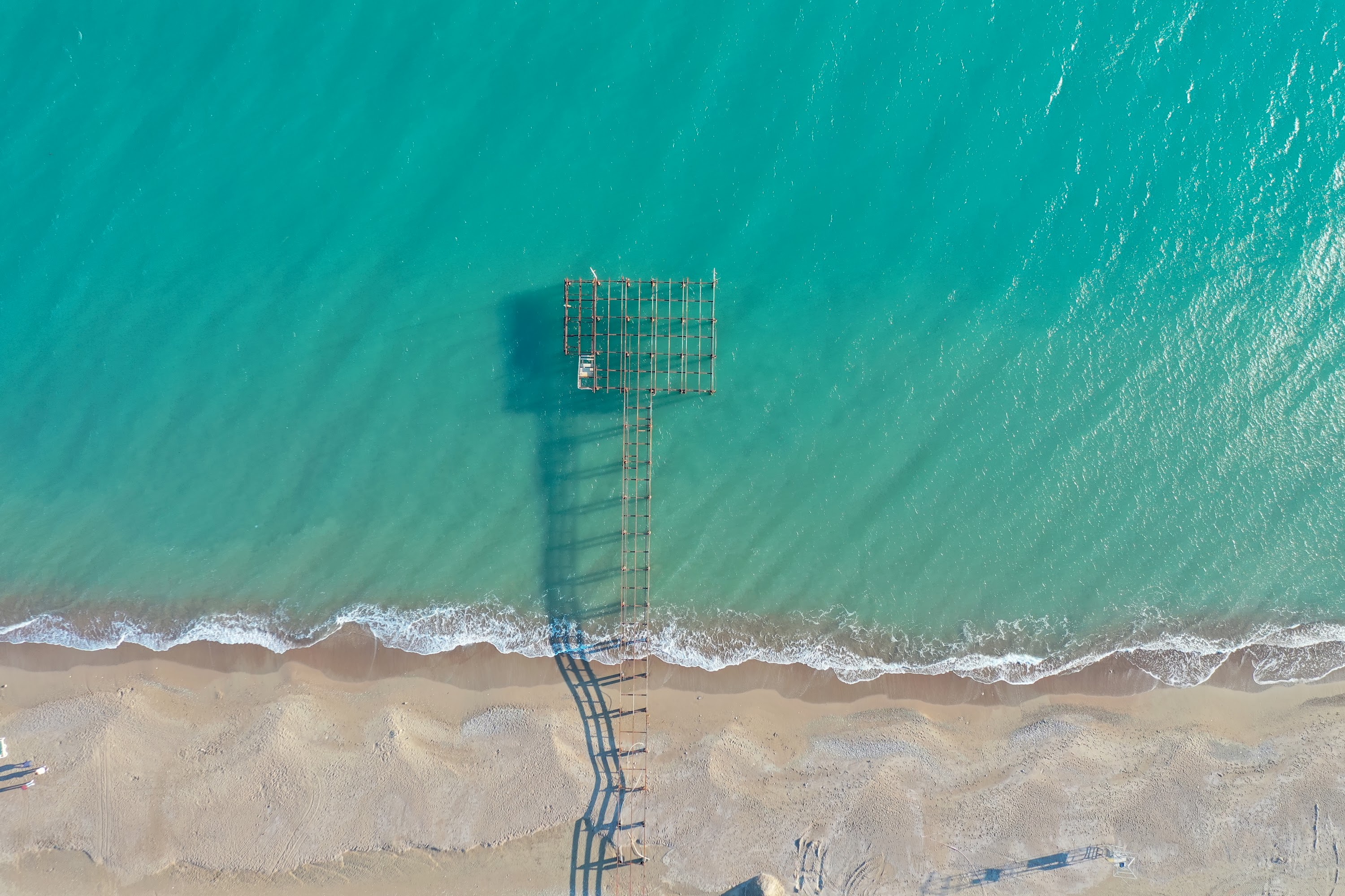 Aerial View of Wooden Pier and T-Platform Extending into Turquoise Sea