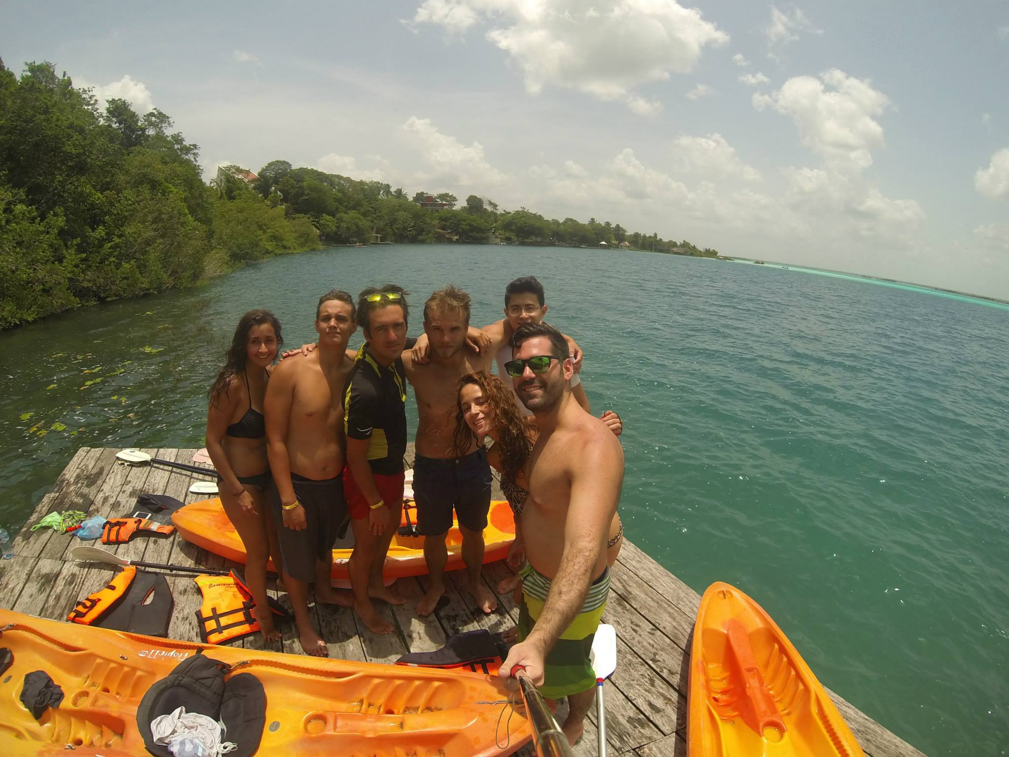 Group of Friends on Kayak Dock by the Water