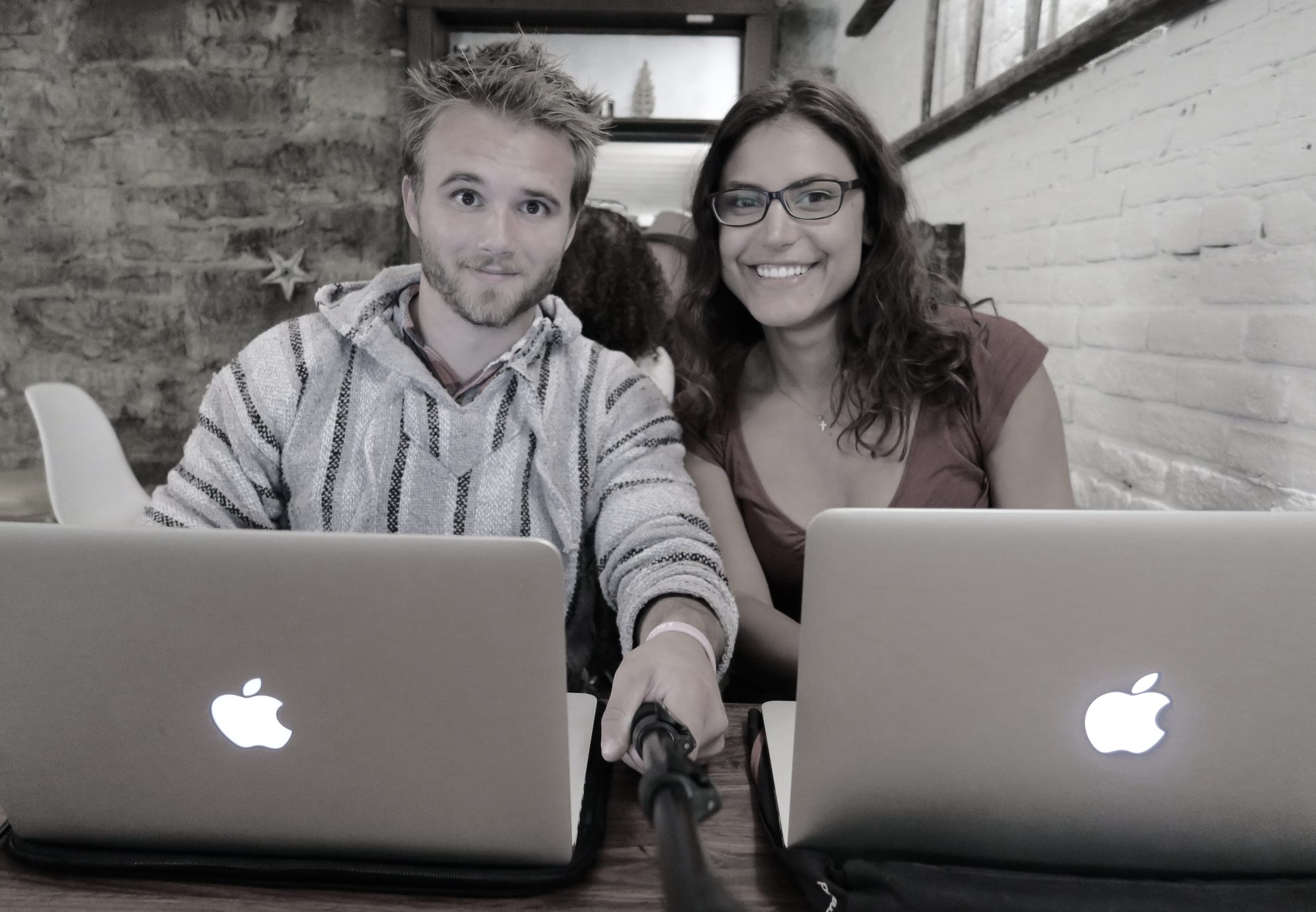 Two People Working on Laptops in a Casual Setting