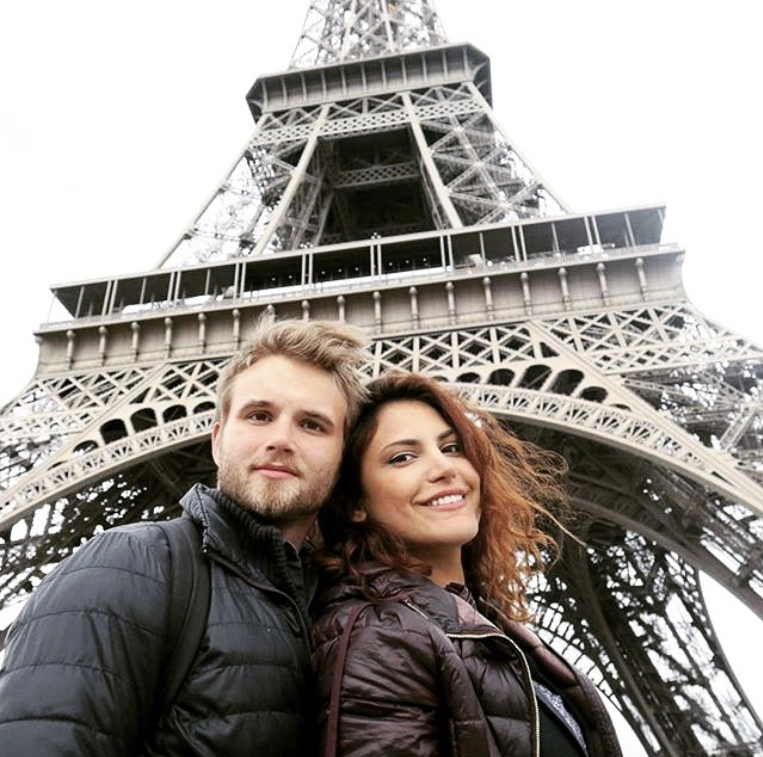 Couple Taking Selfie Under the Eiffel Tower