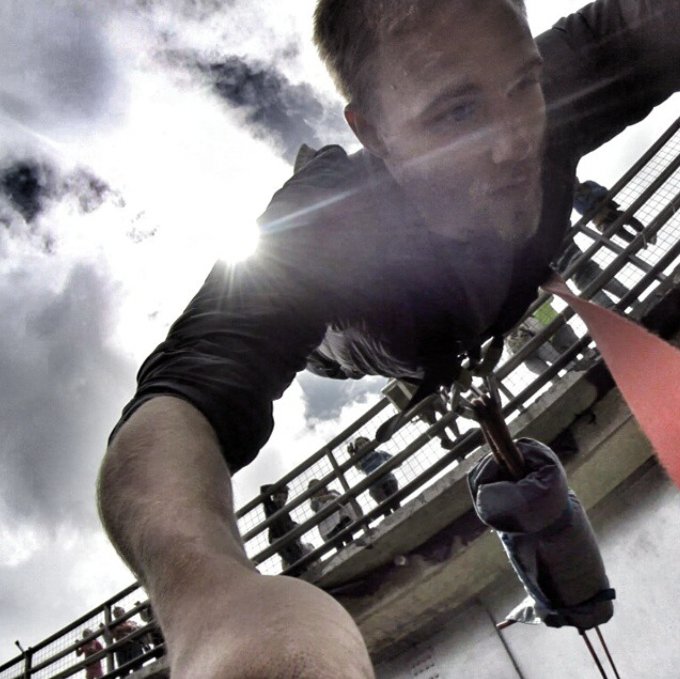 Man Performing Parkour on Metal Structure