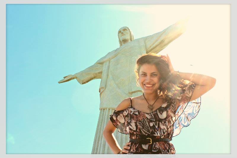 Woman Smiling in Front of Christ the Redeemer Statue