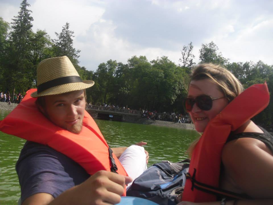 Couple in Life Jackets on a Boat