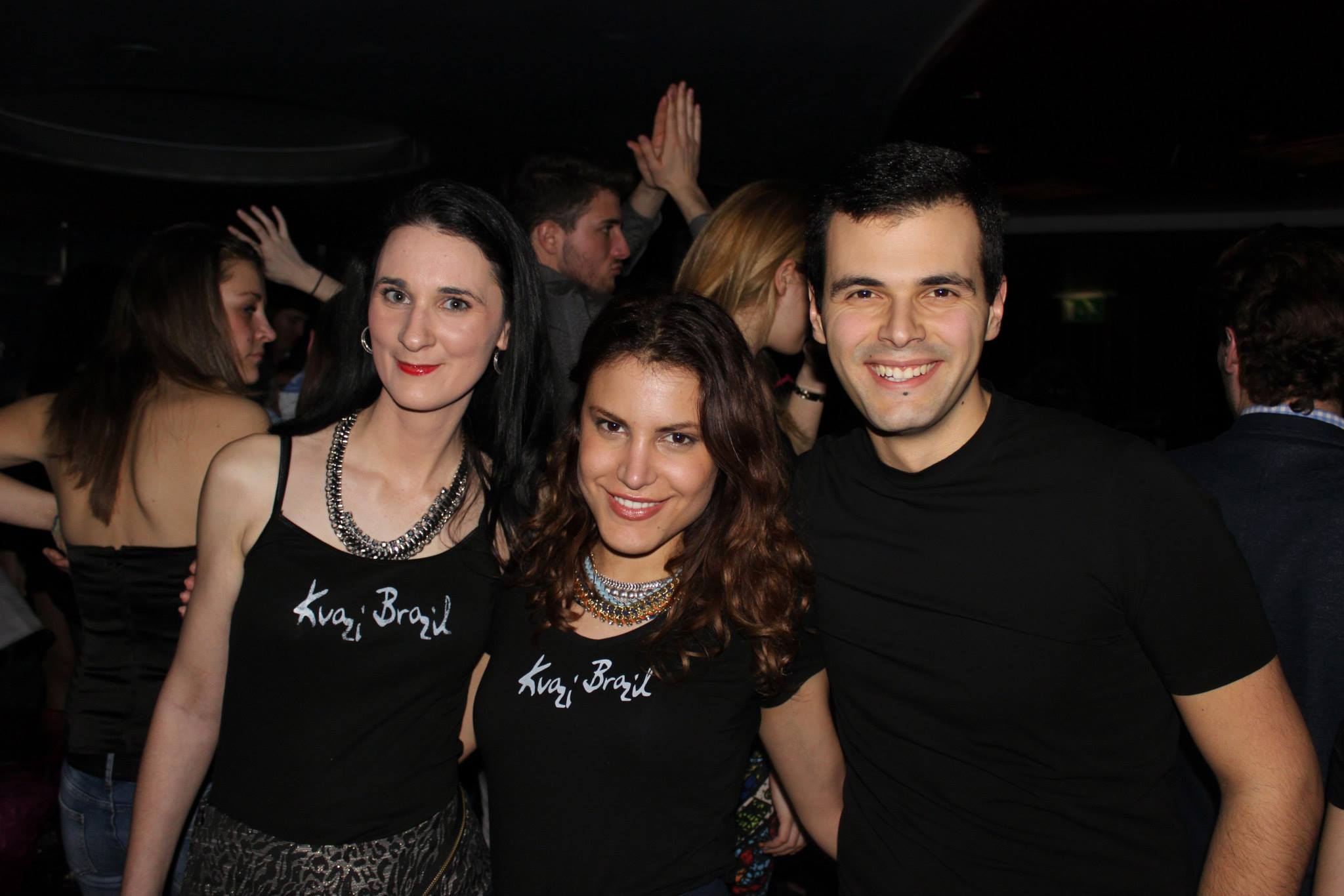 Three People Posed at a Party