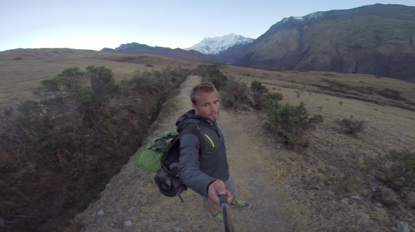 Hiker Taking Selfie on Mountain Trail at Dawn