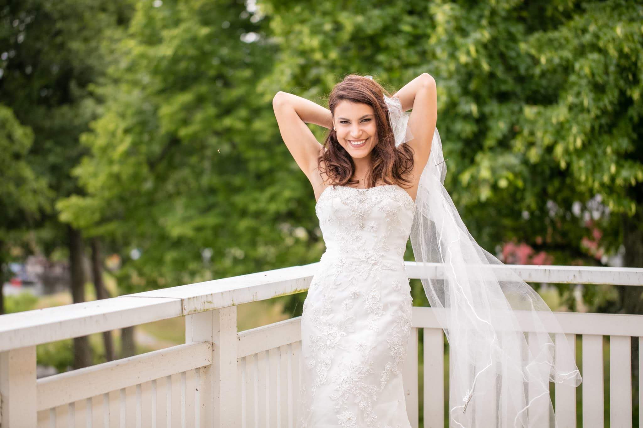 Bride Smiling on White Bridge