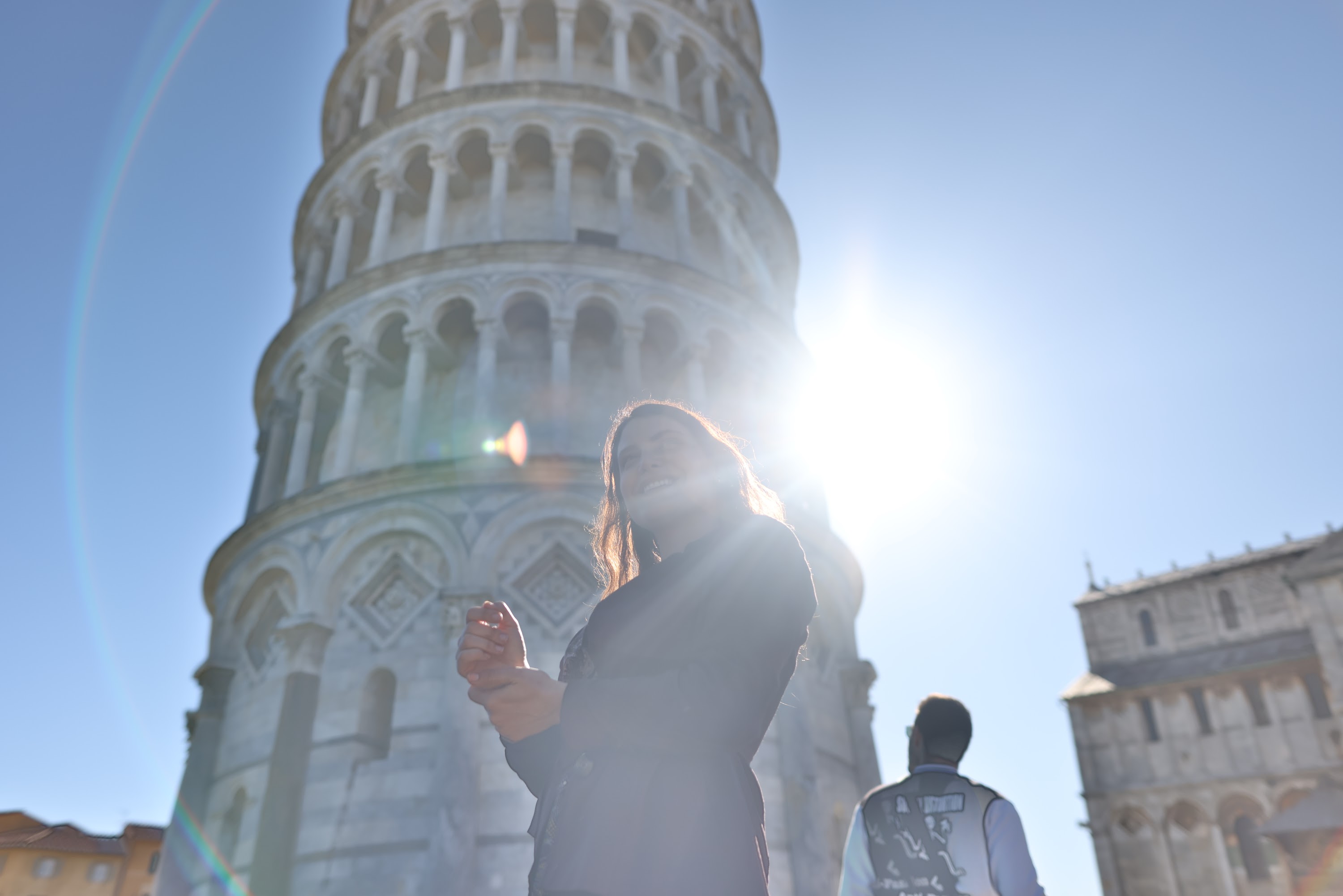Tourists at the Leaning Tower of Pisa on a Sunny Day