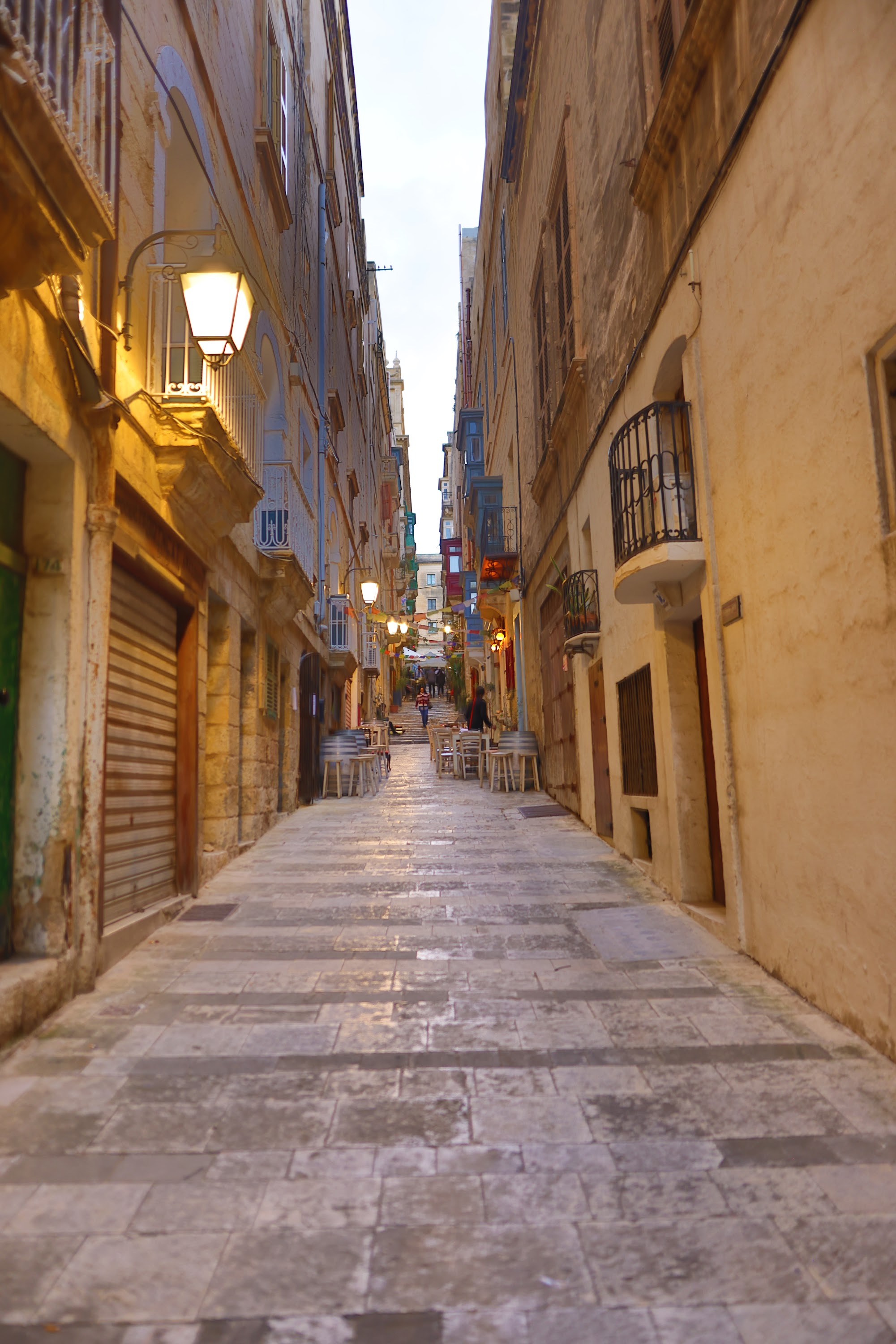 Narrow Historic Street with Stone Pavement and Old Buildings