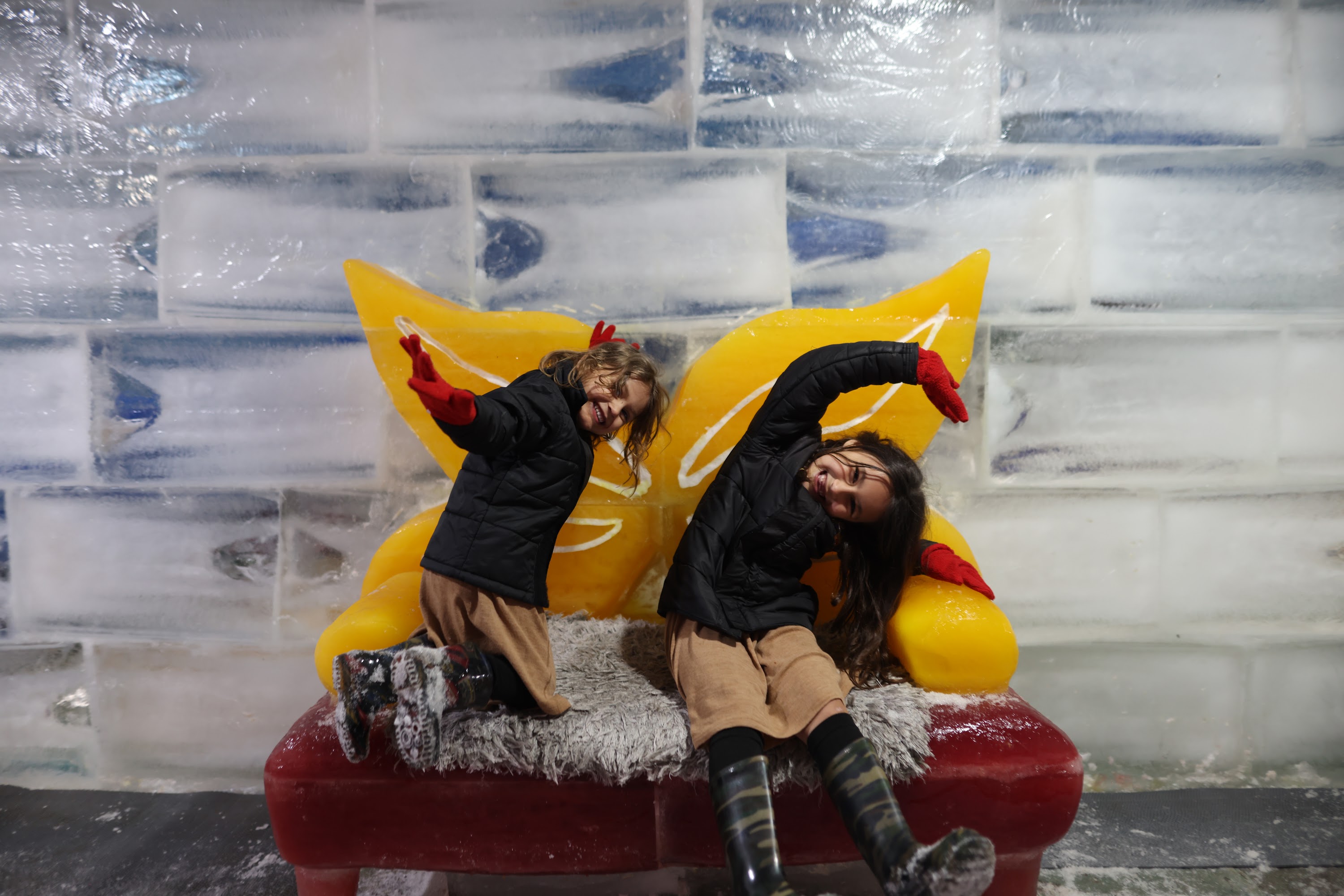 Children Playing on Ice Sculpture Bench