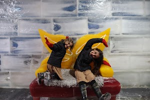 Children Playing on Ice Sculpture Bench