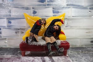 Children Playing on Ice Sculpture Bench