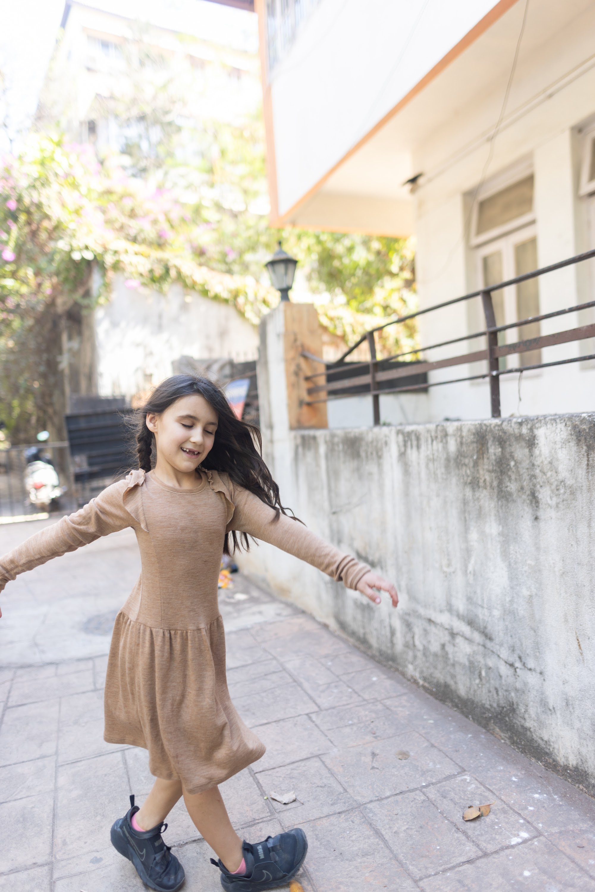 Girl Dancing in Urban Courtyard