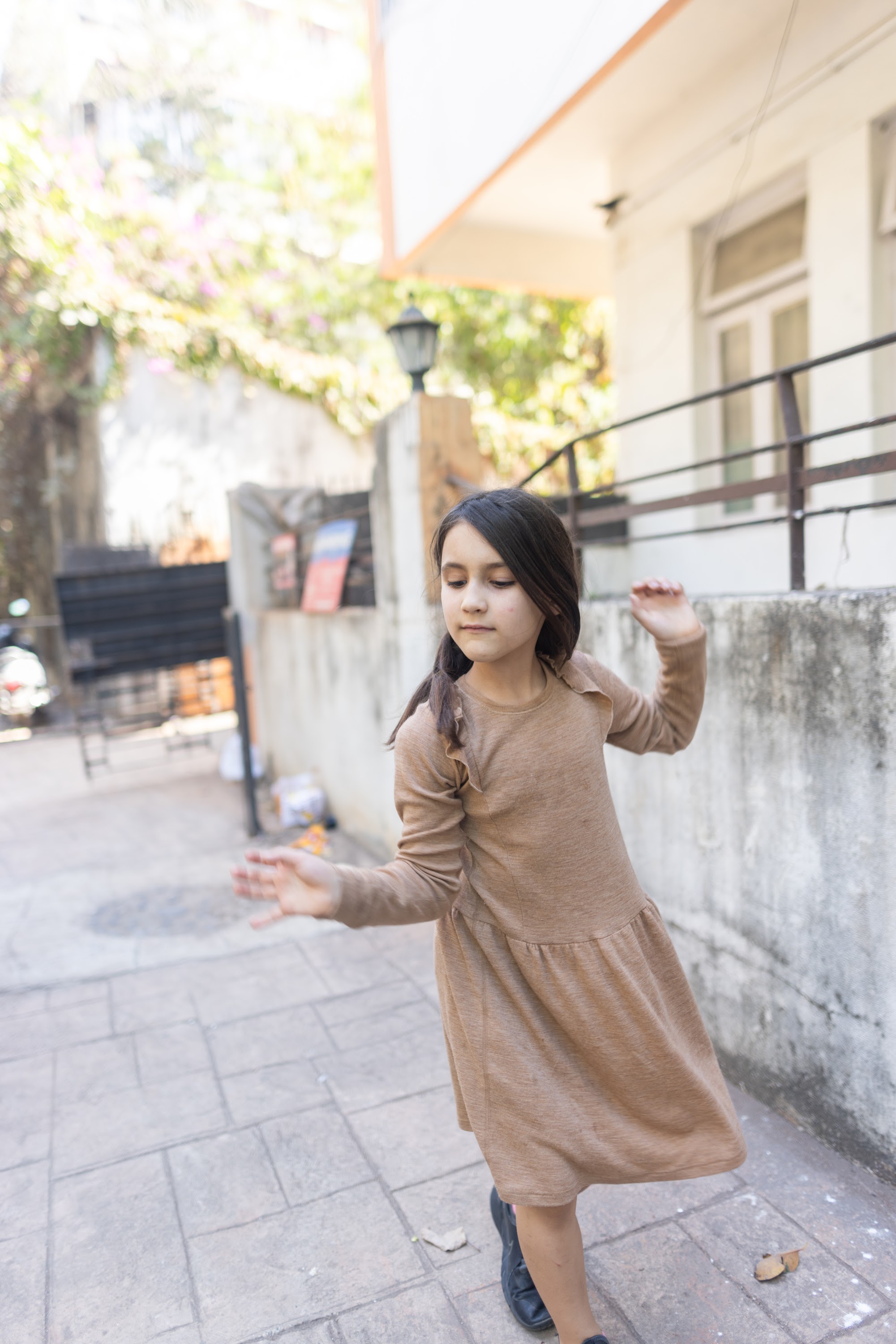 Girl Dancing in Urban Courtyard