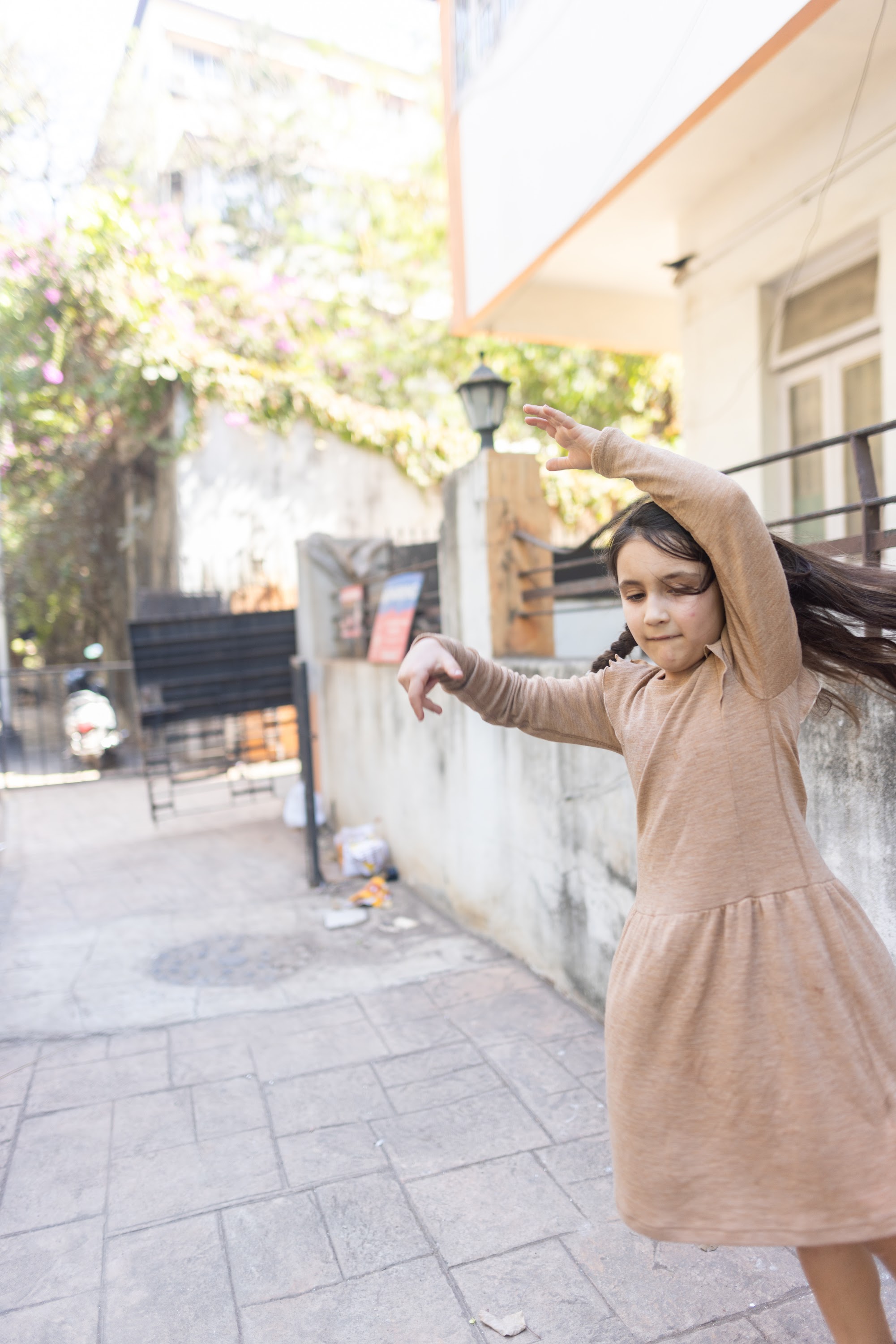 Girl Dancing in Urban Courtyard