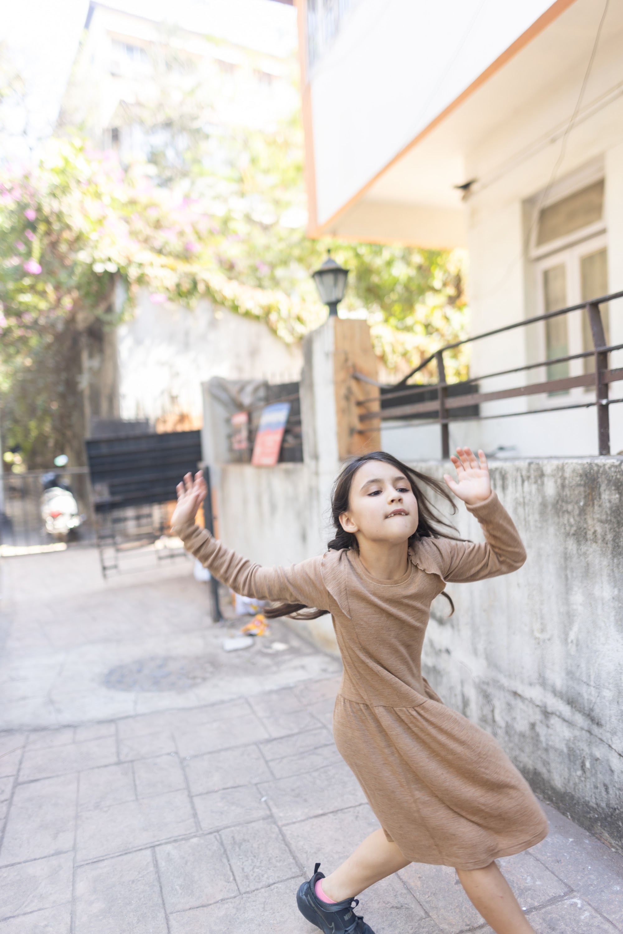Girl Dancing in Urban Courtyard
