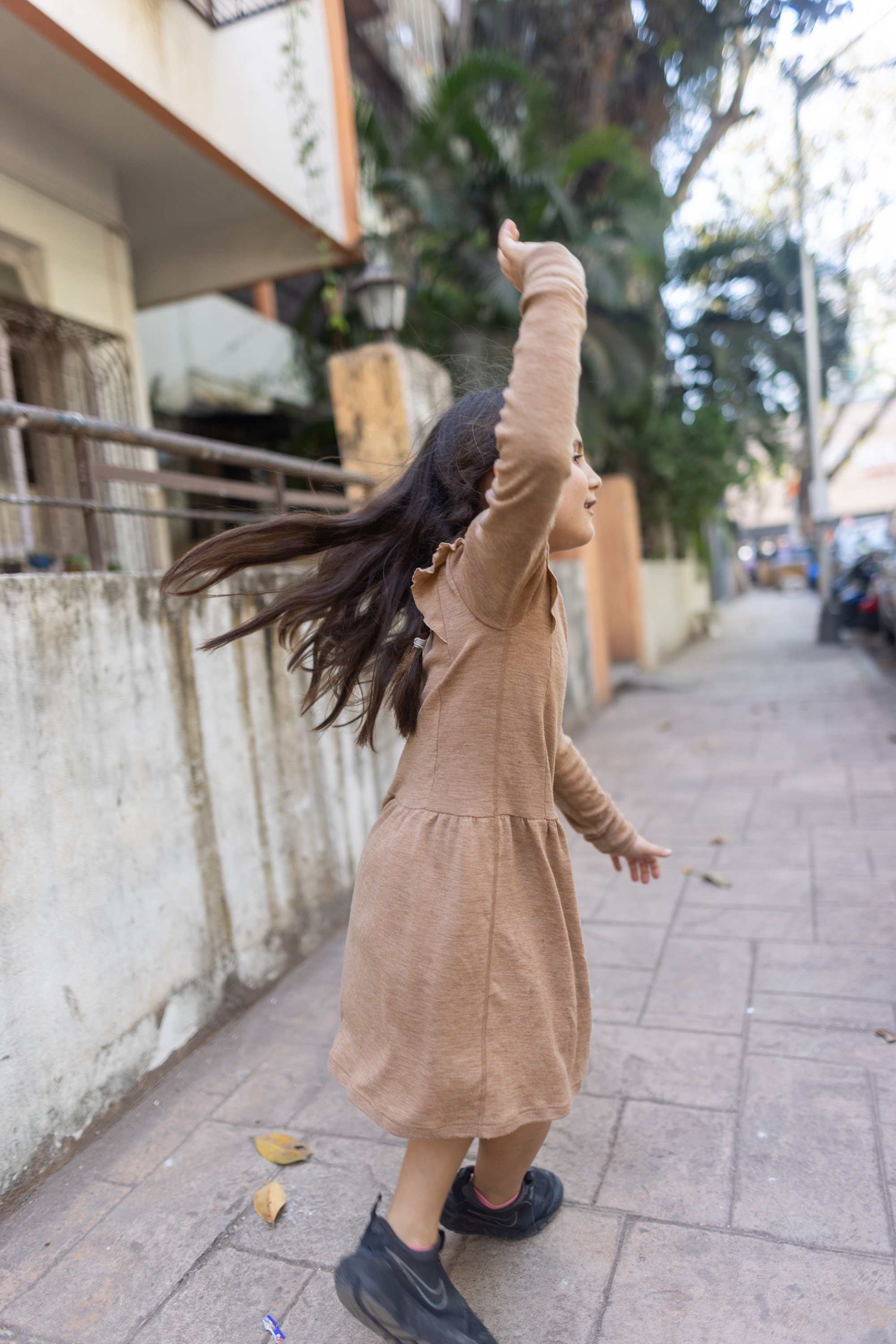 Girl Dancing on Sidewalk