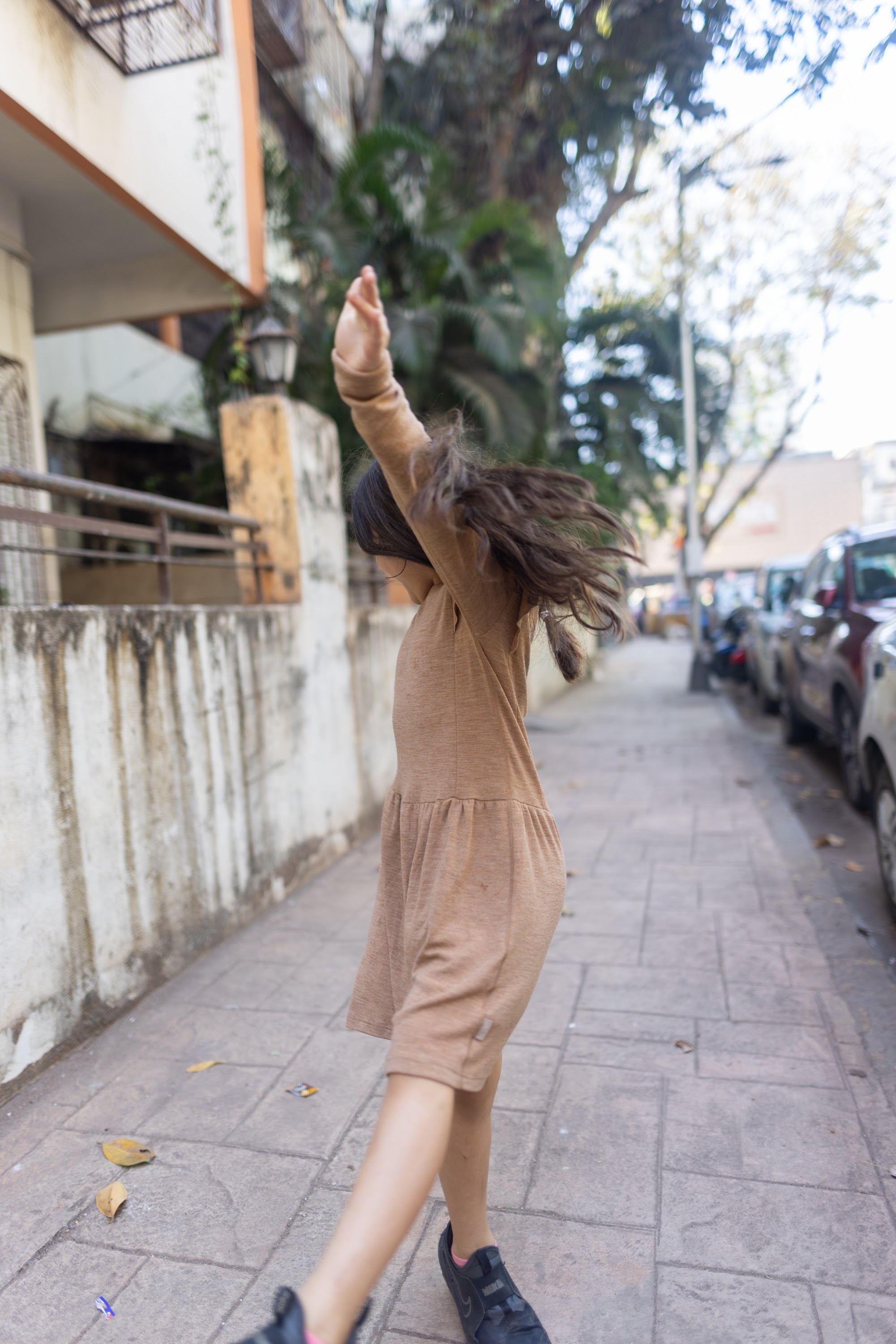 Girl Dancing on Sidewalk