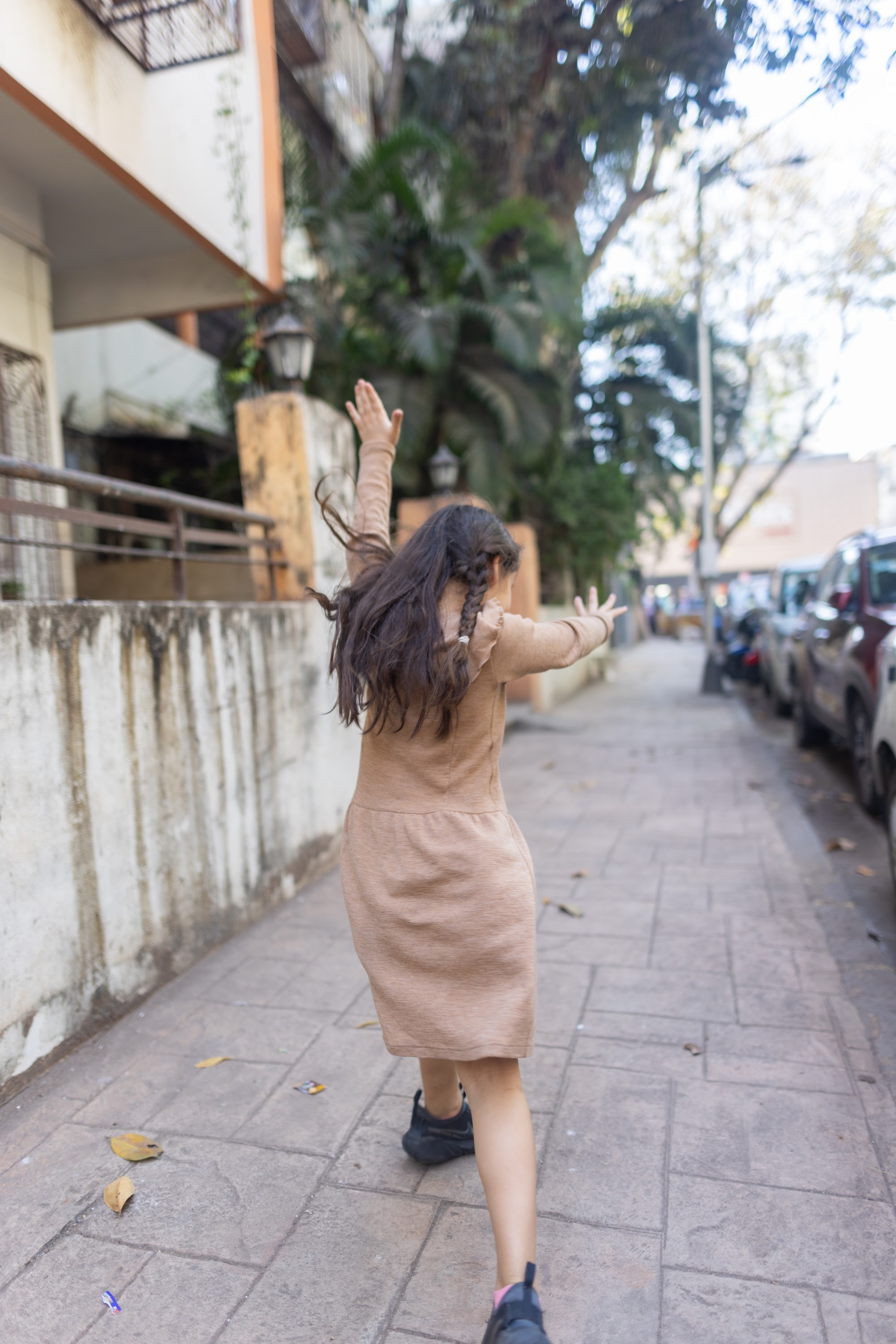 Girl Dancing on Sidewalk