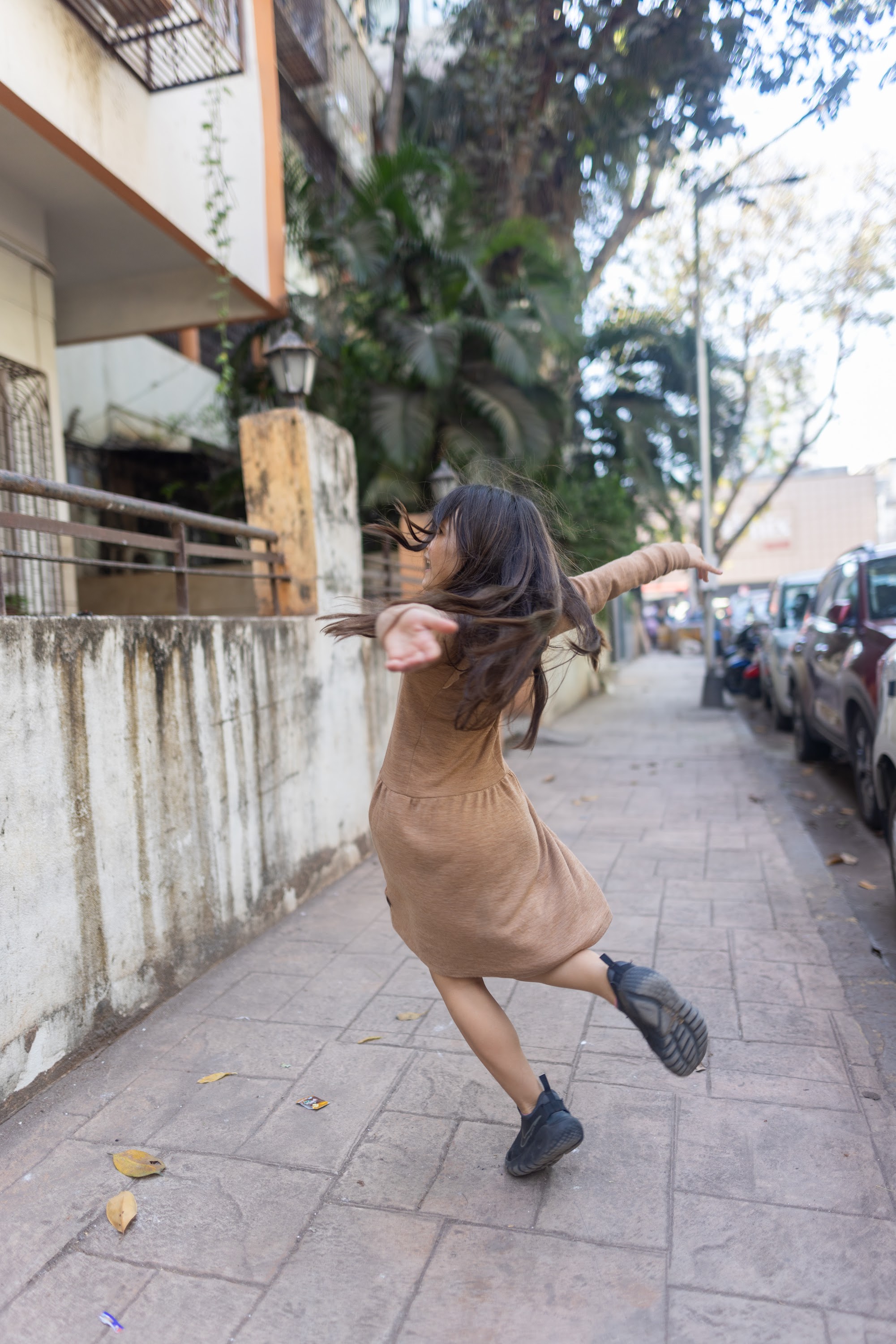 Dancing Girl on Sidewalk