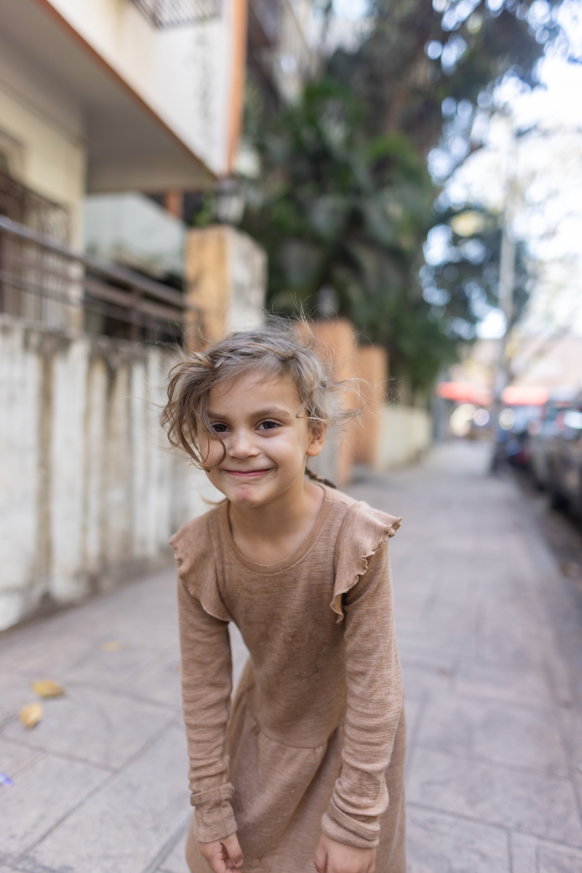 Smiling Girl on Urban Street