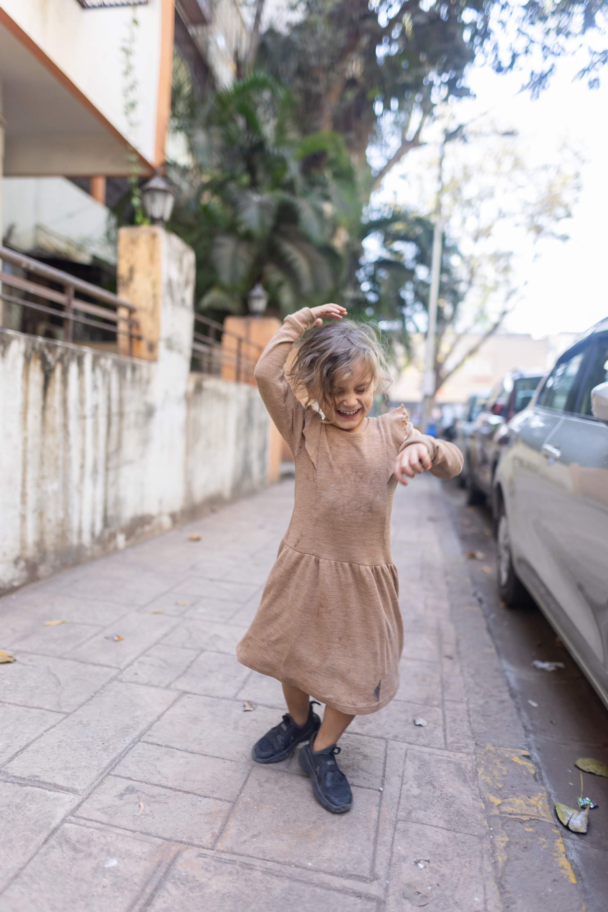 Girl Dancing on Sidewalk