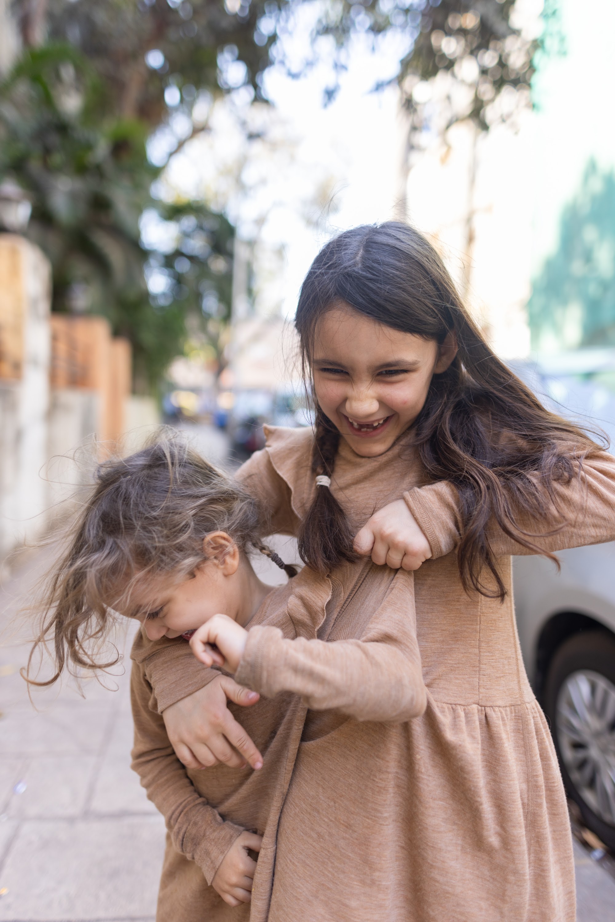 Sisters Playing Outdoors
