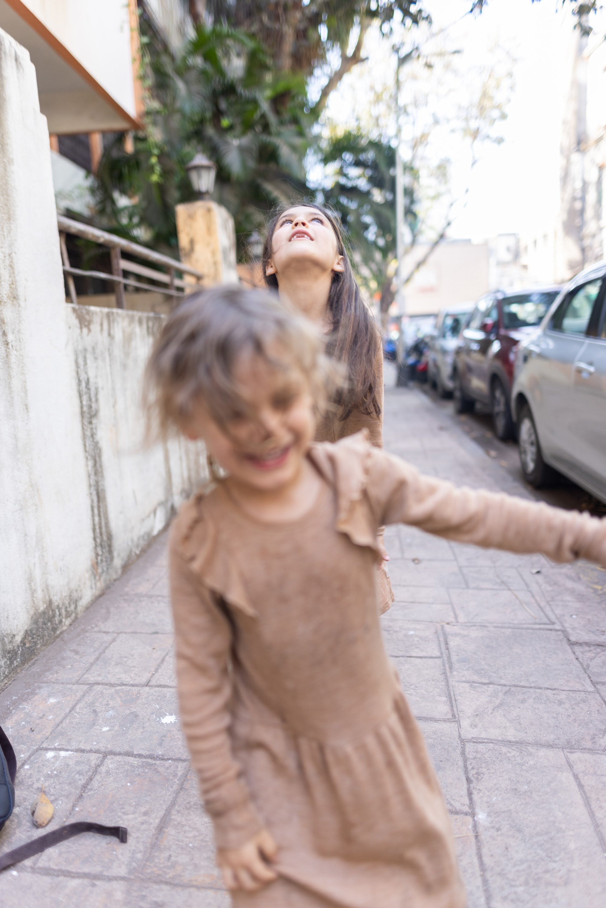 Children Playing on a City Sidewalk