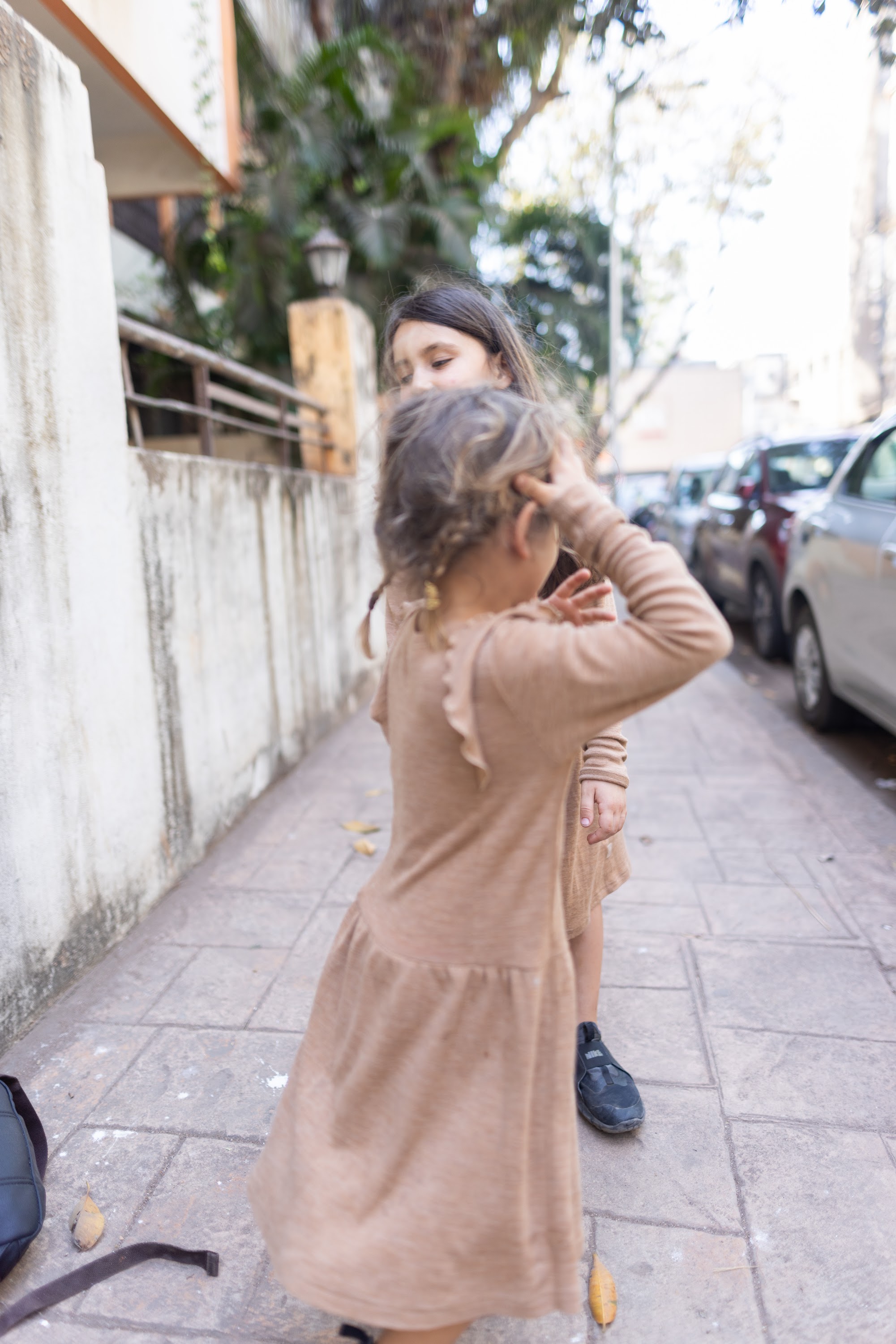 Children Playing on a Sidewalk