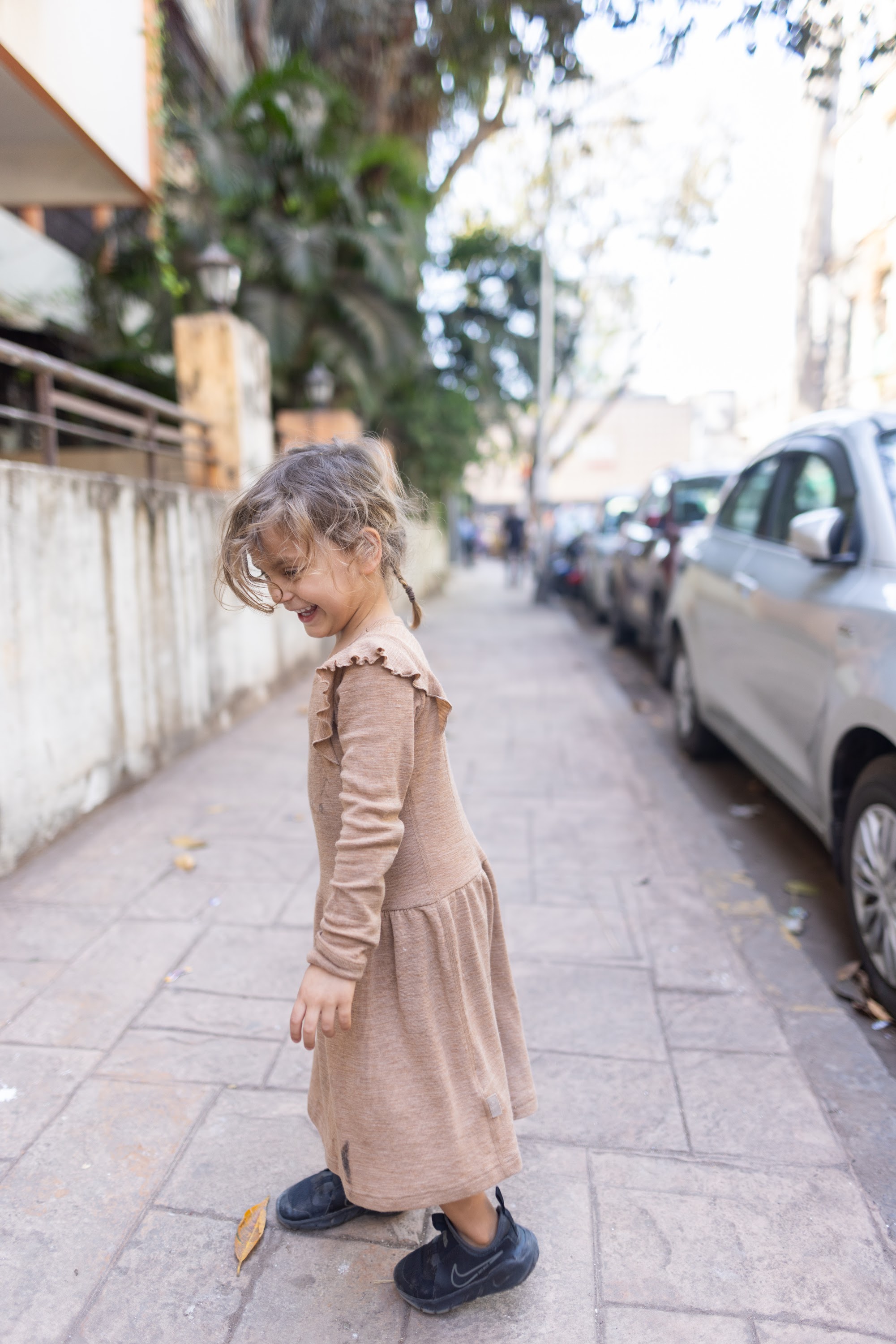 Little Girl Walking on Sidewalk