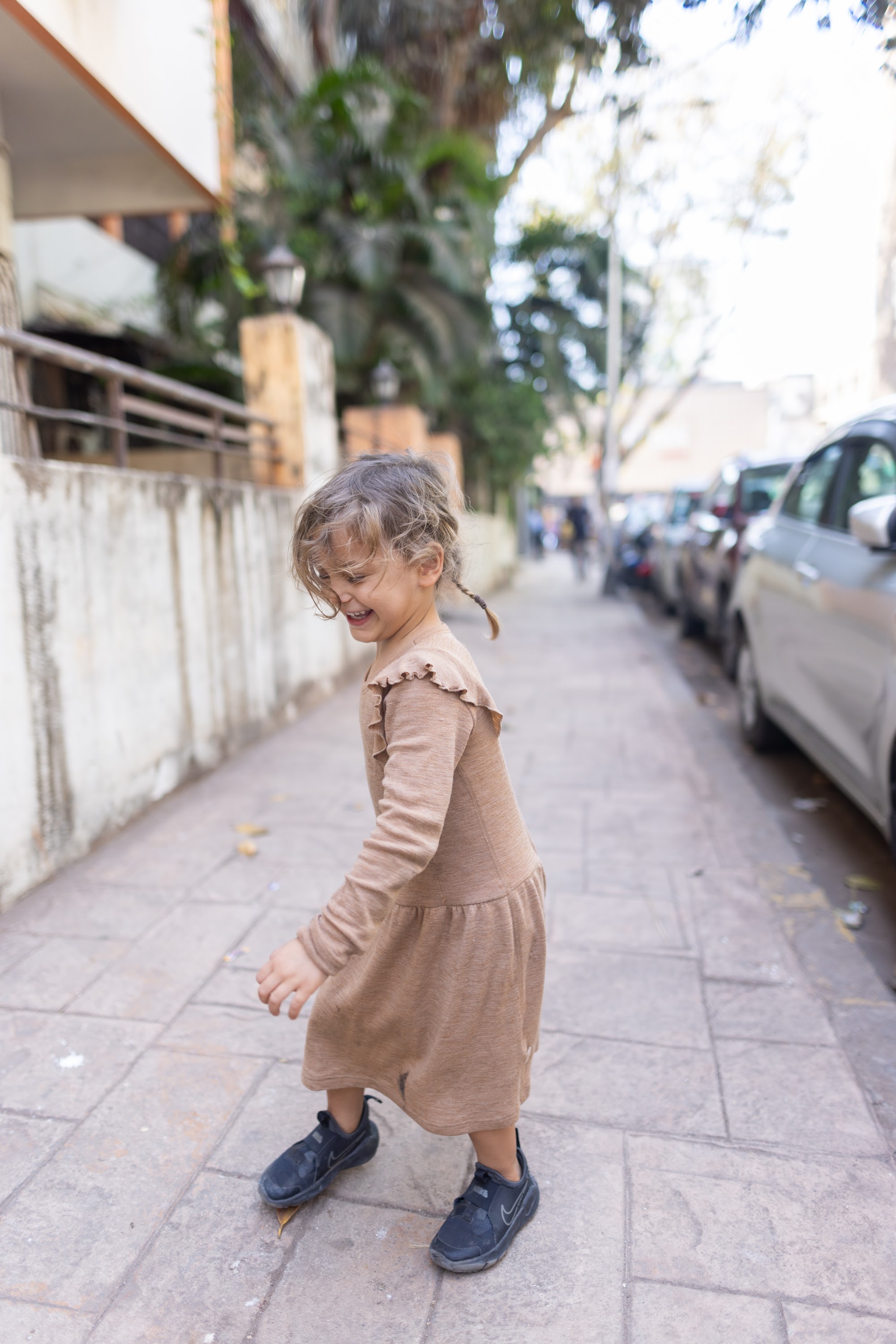 Child Walking on Sidewalk