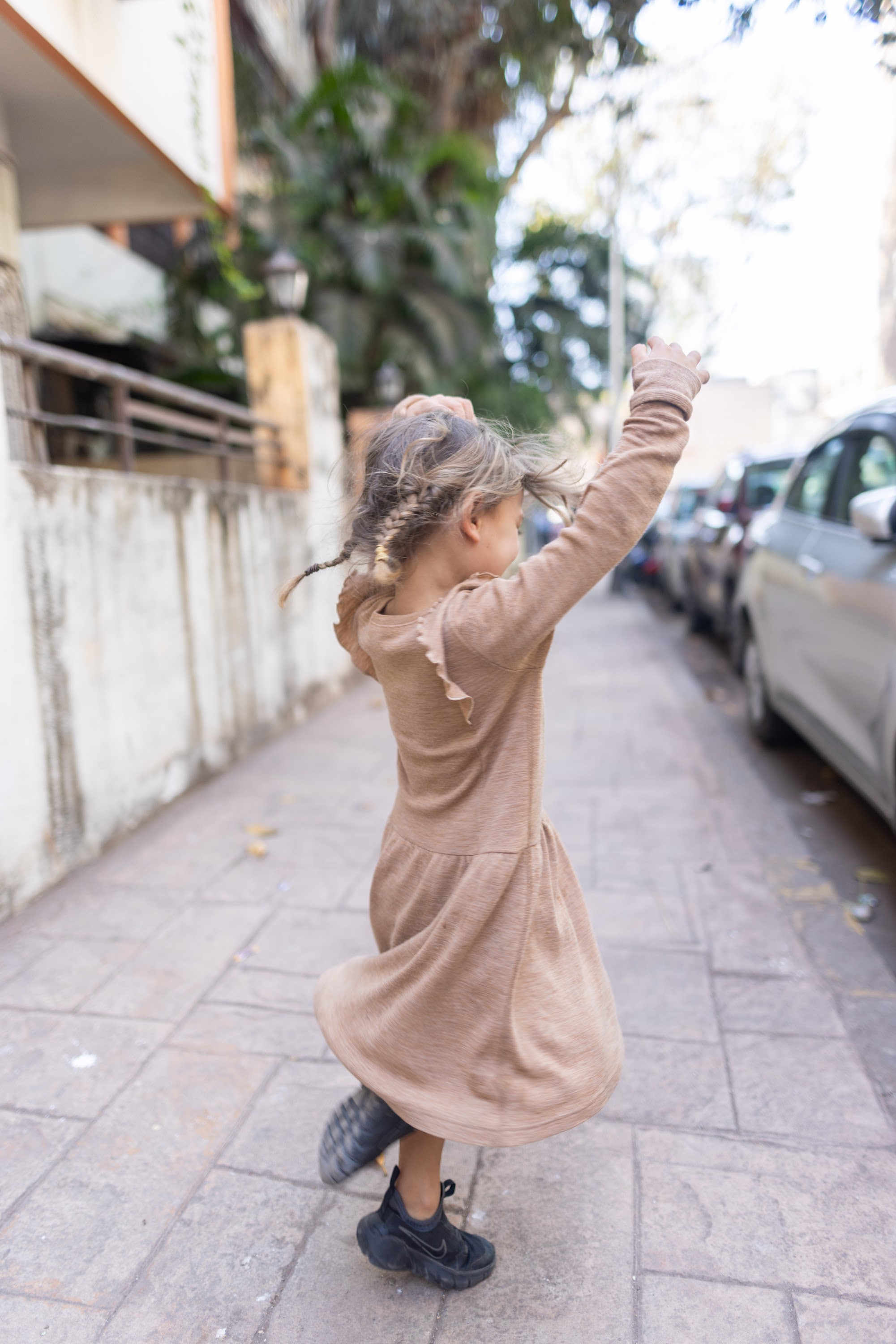 Girl Dancing on Sidewalk