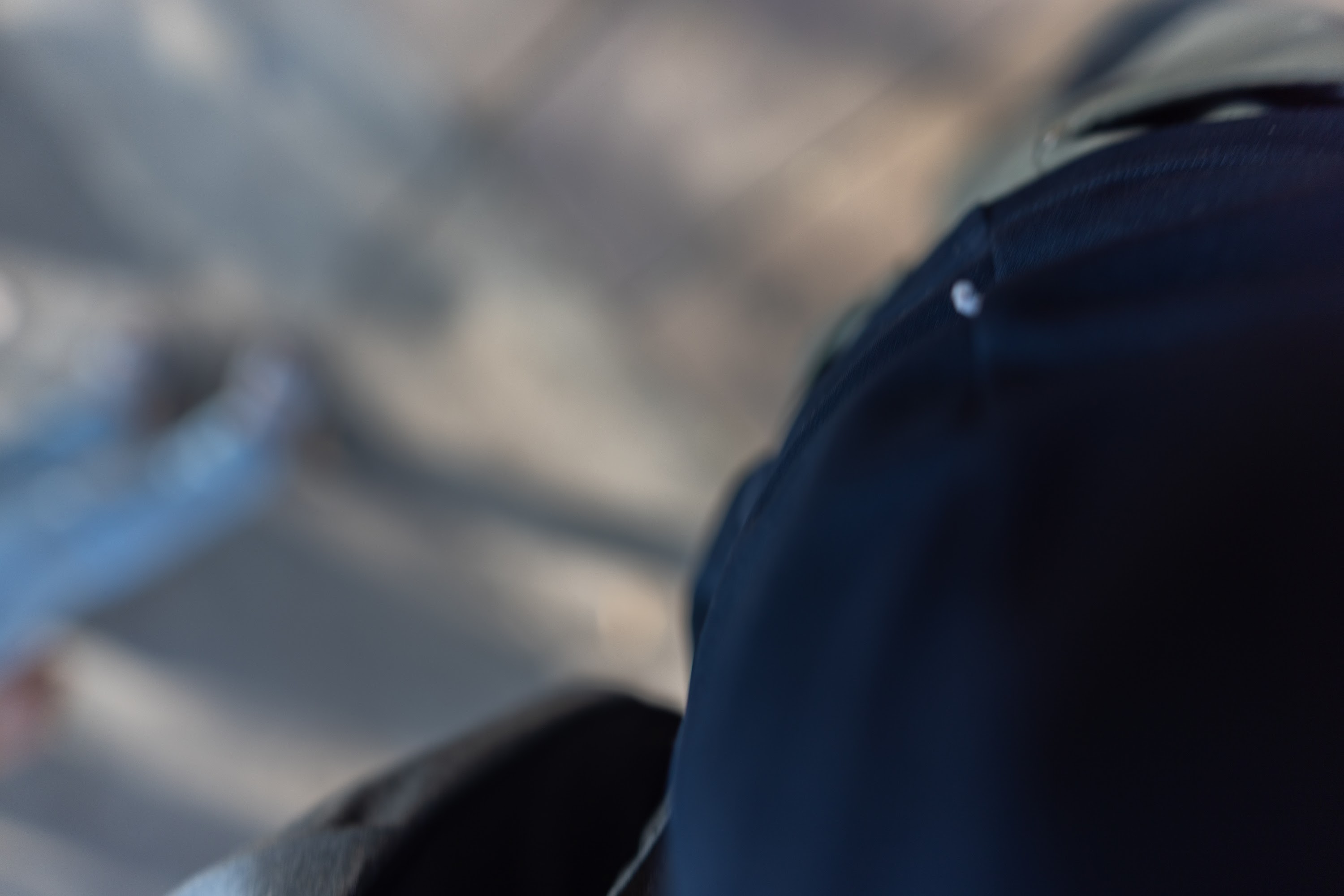Close-up of Dark Clothing with Blurred Background