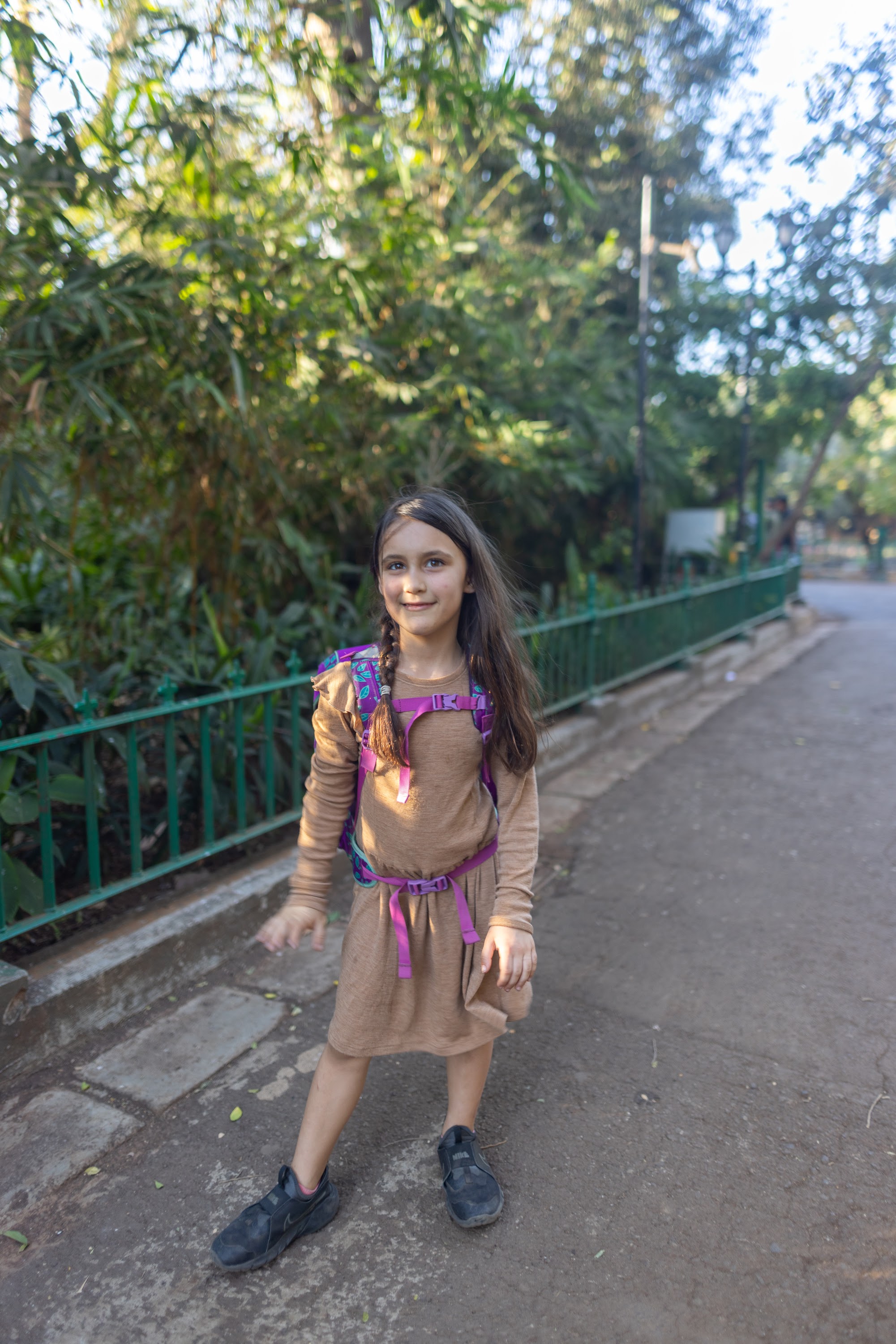 Girl with Backpack on a Park Path