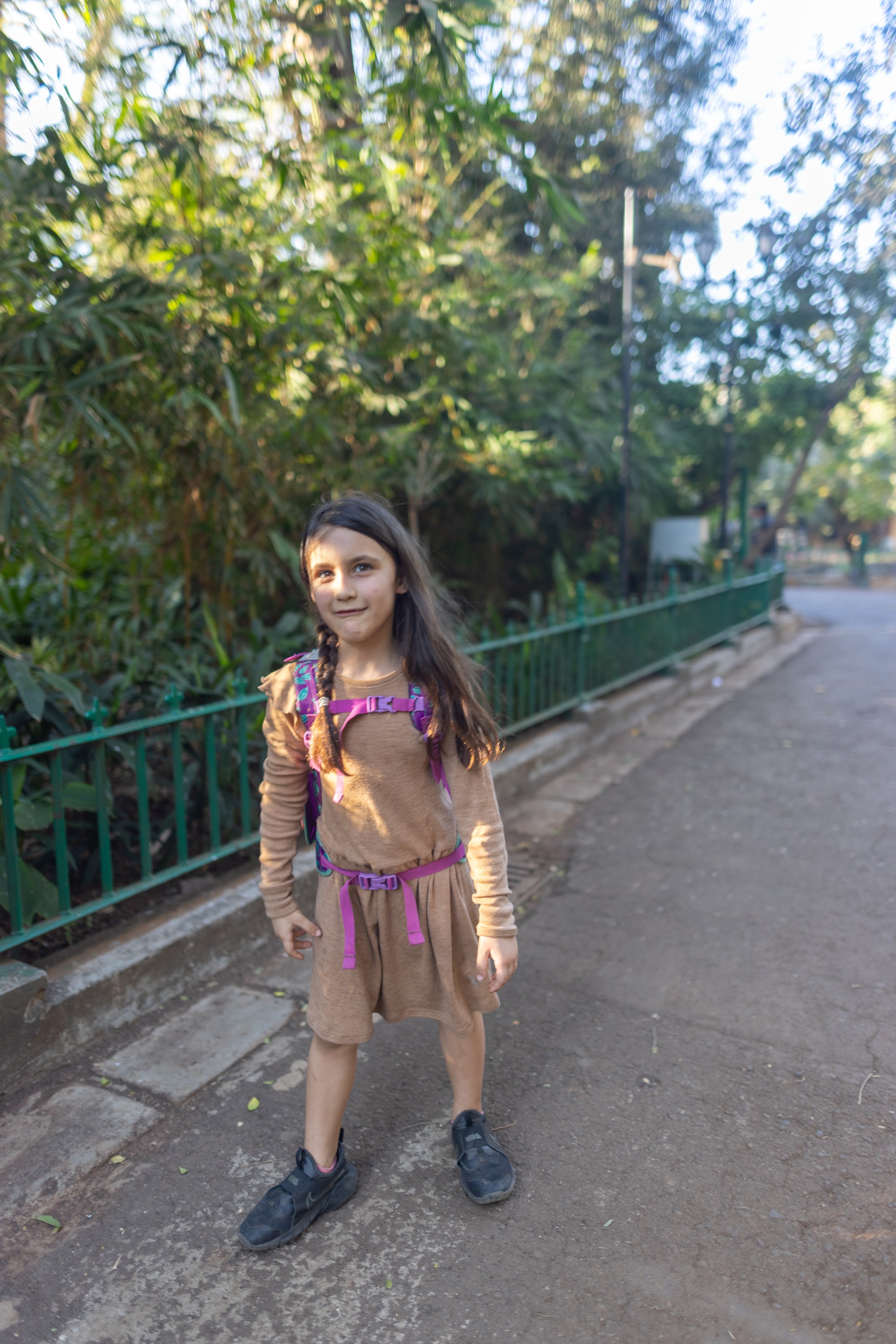 Girl Standing on Pathway in Park