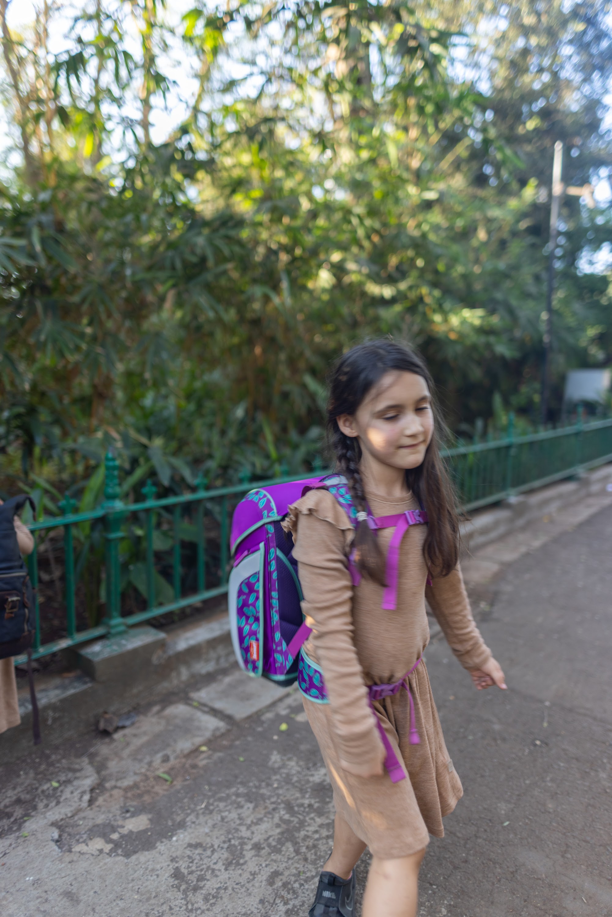 Girl Walking with Backpack on Path