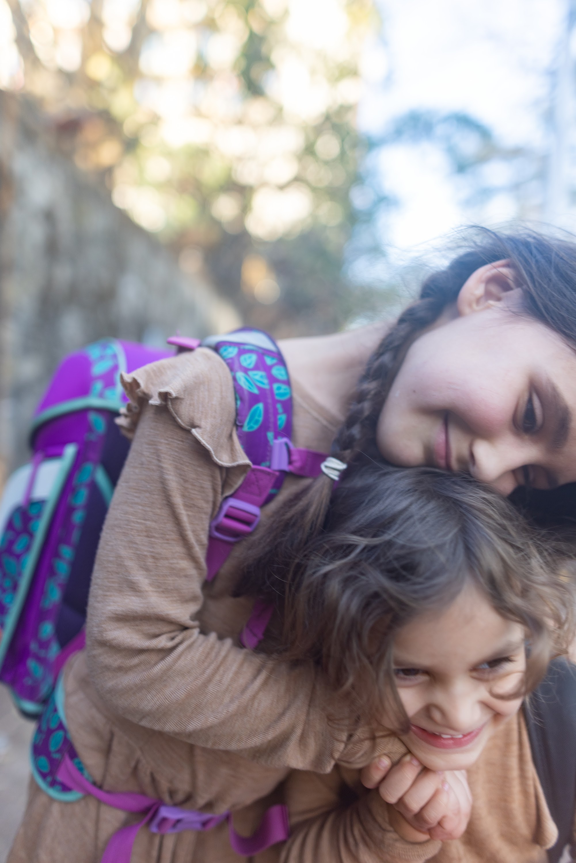 Two Girls Embracing Outdoors