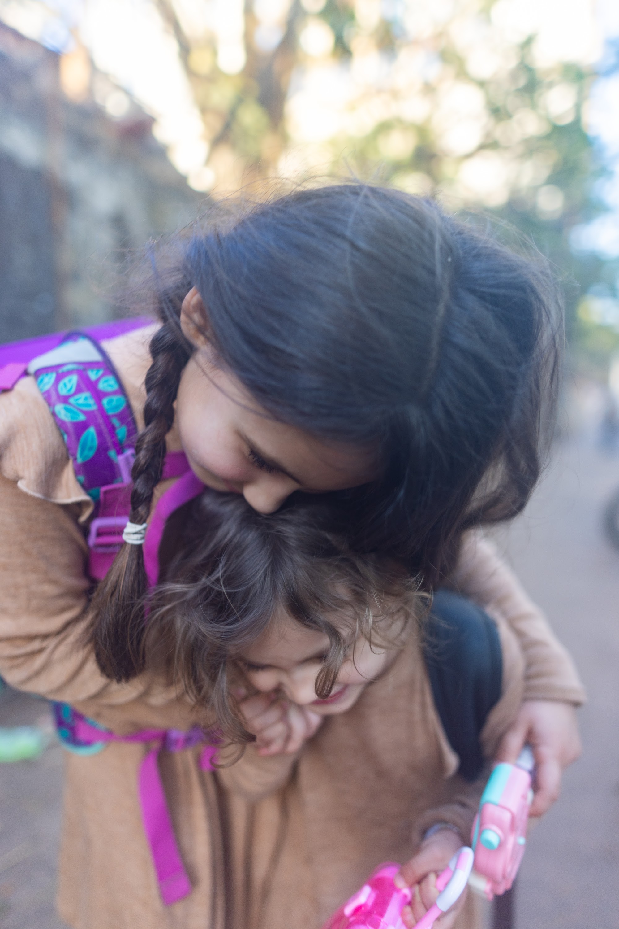 Sibling Hug on a Sunny Day