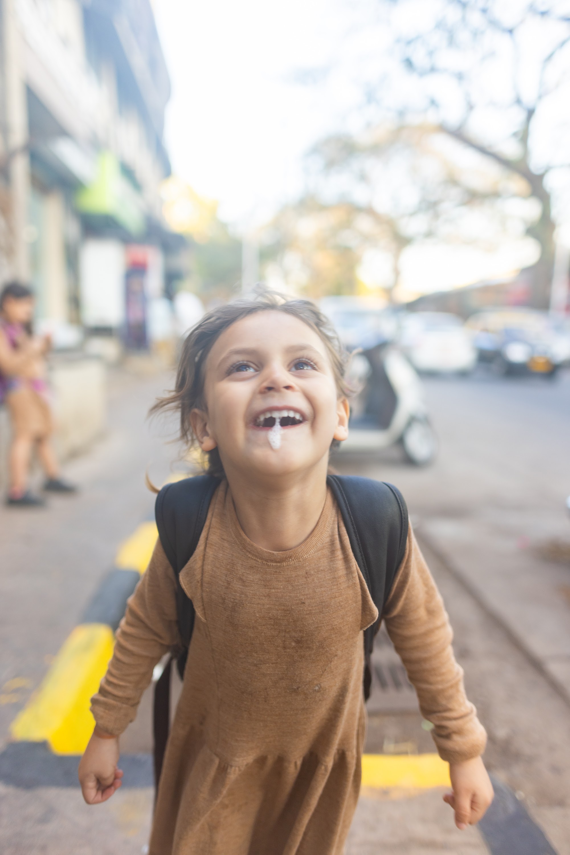 Happy Child Laughing on Street
