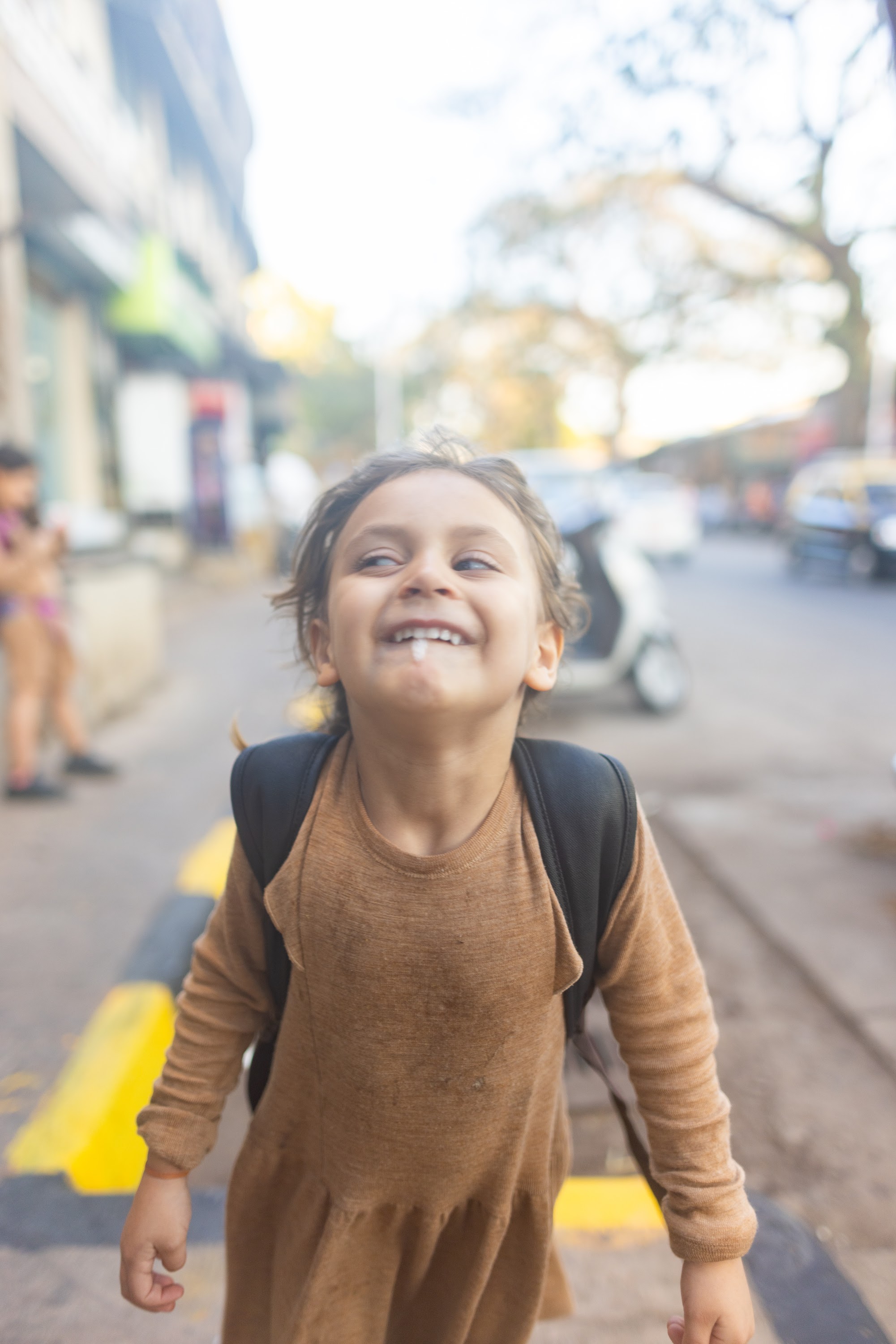 Happy Child Walking on Street