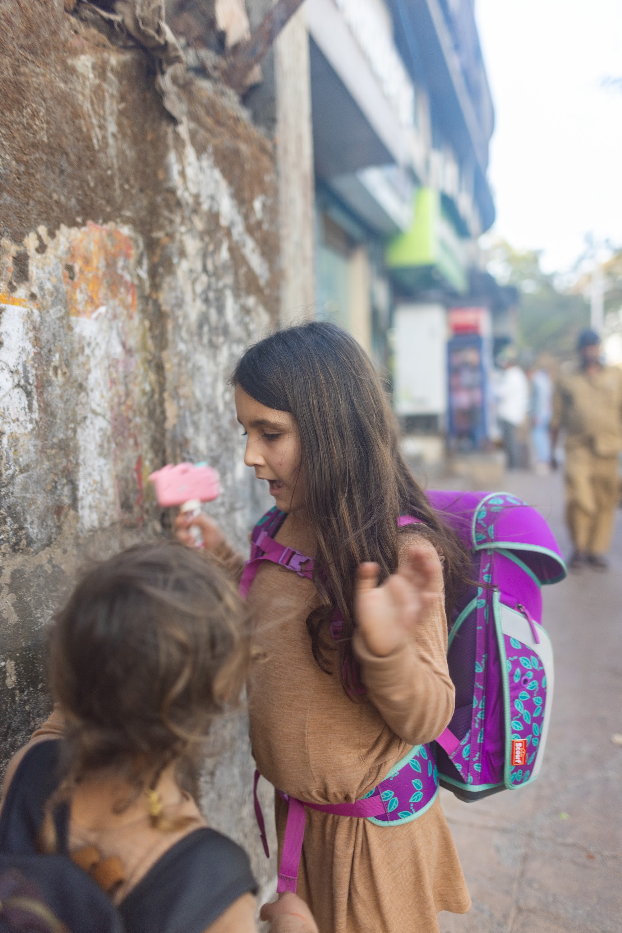 Girl Eating Ice Cream on Street