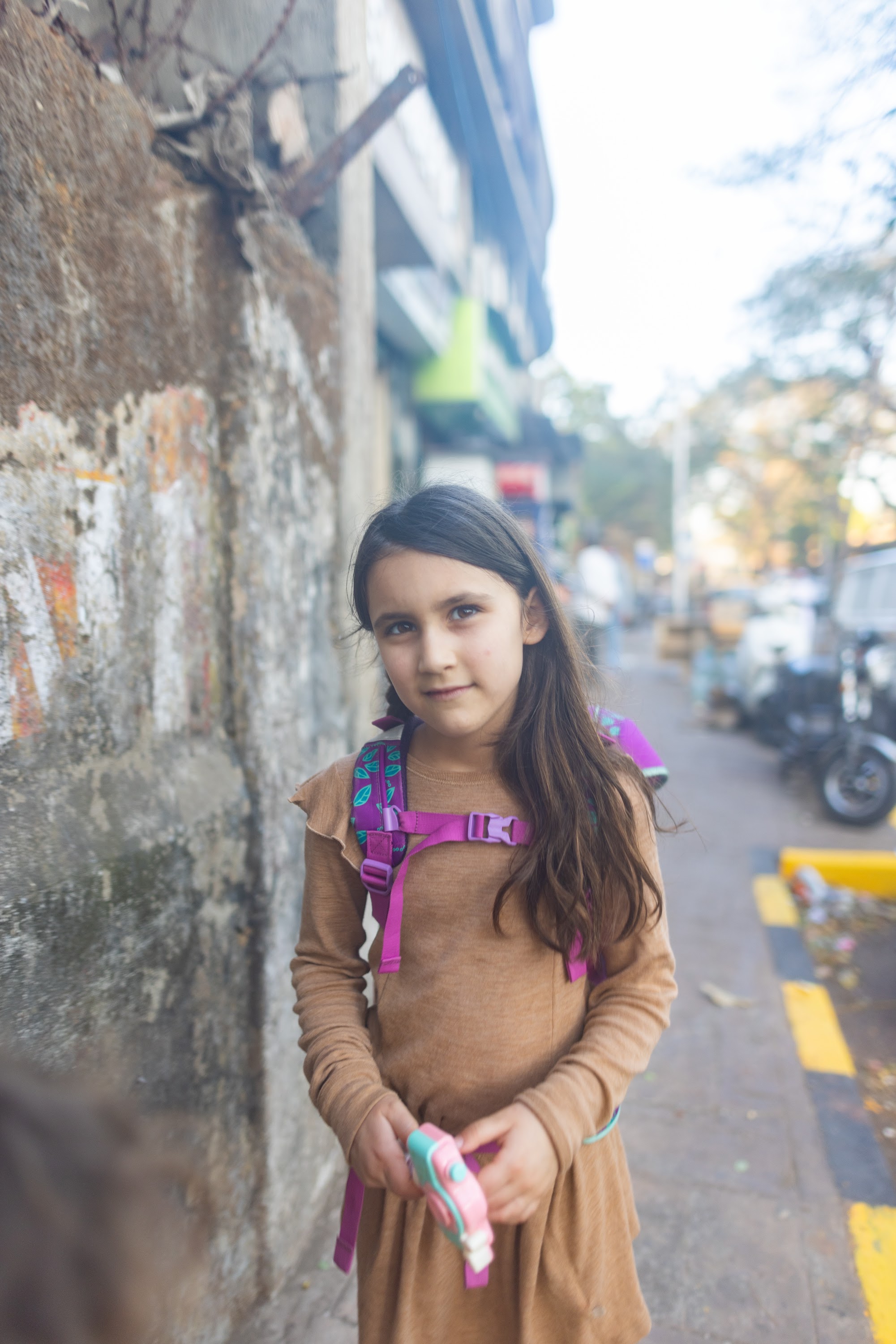 Girl with Backpack on Street